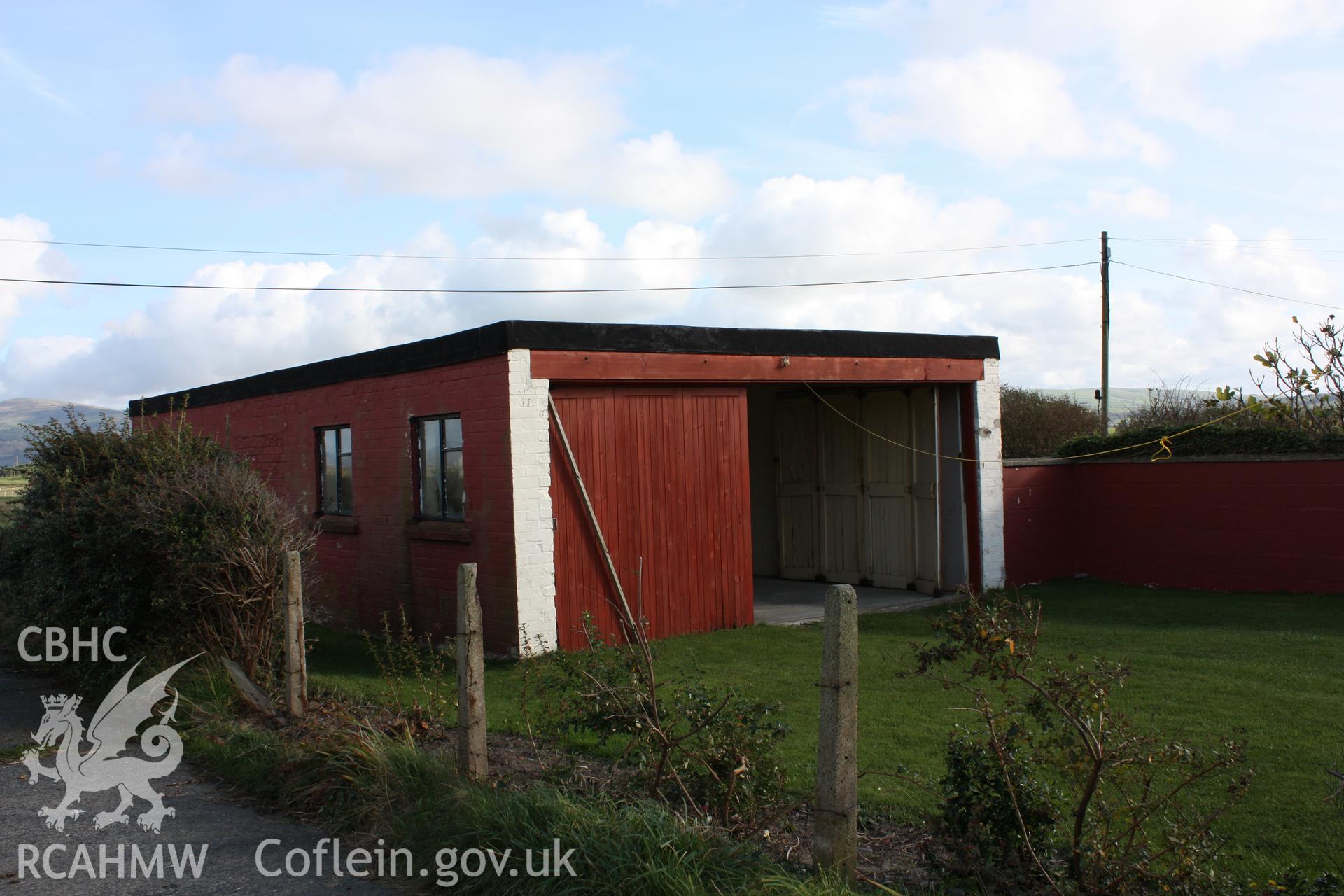 Large sliding doors of the former workshop viewed from the military access road (looking southeast).