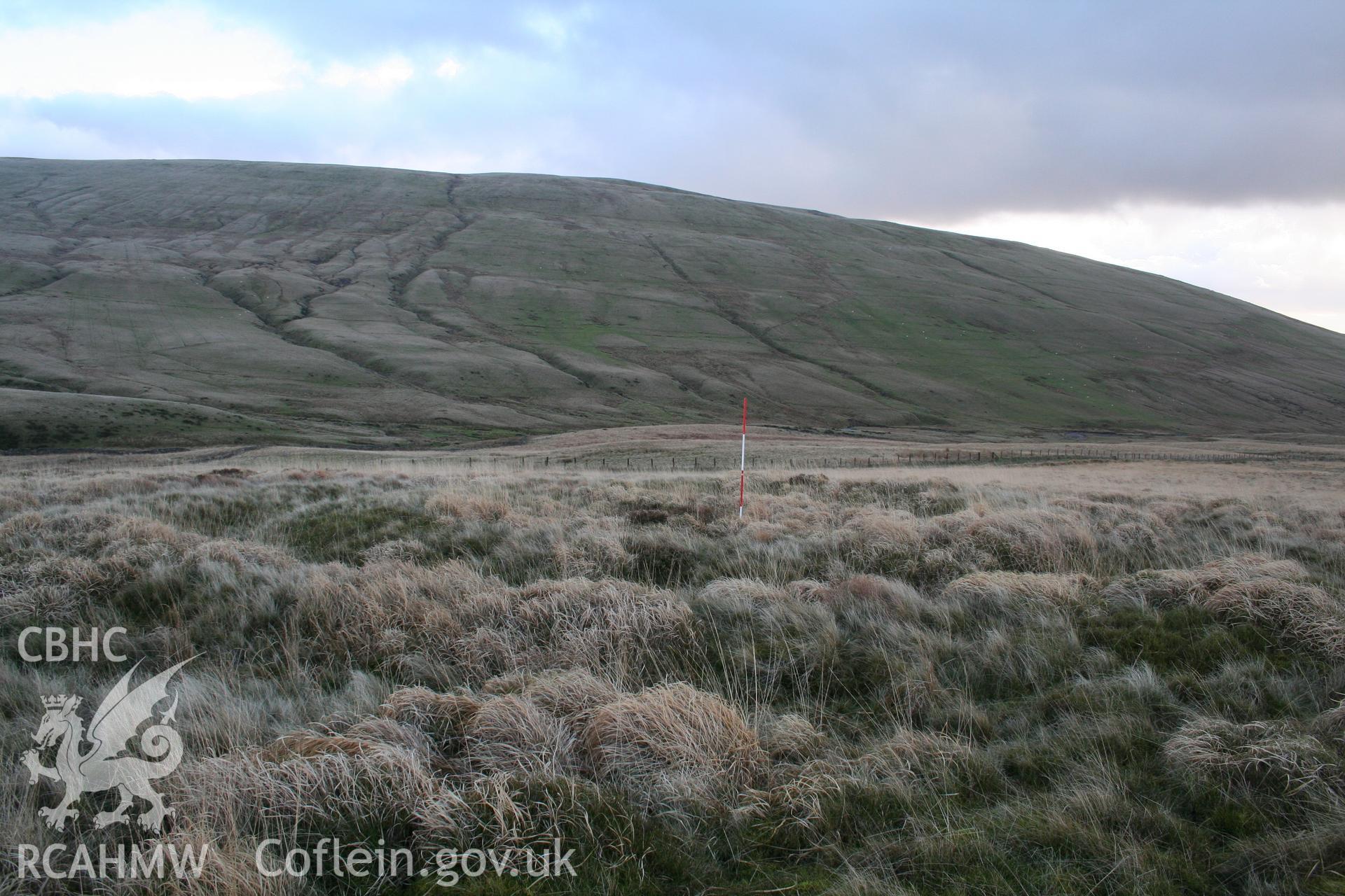 Ring-work viewed from the north showing bank-and-ditch arrangement; 2m scale at centre.