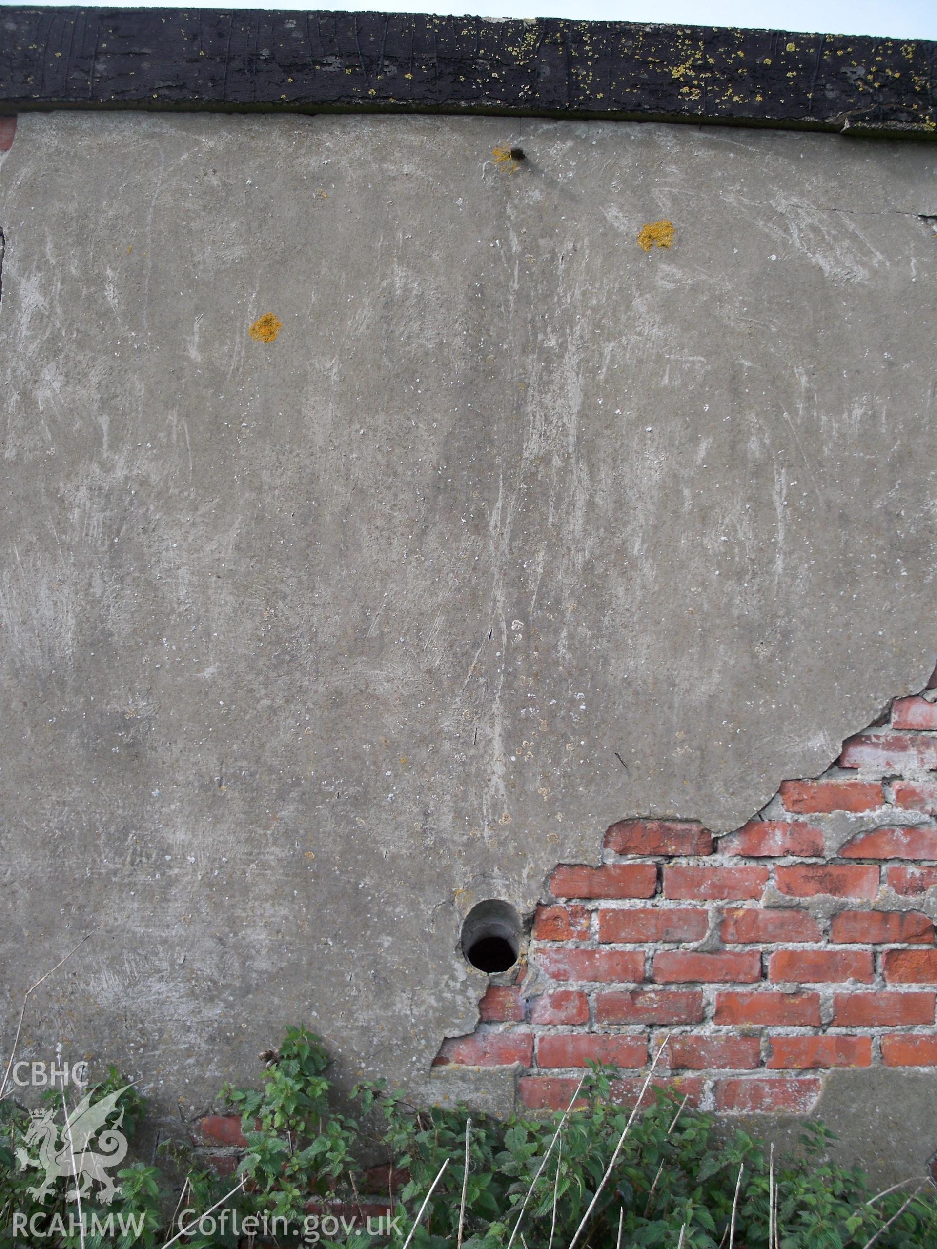 Stove flue vent and decaying render in western walls (exterior view)
