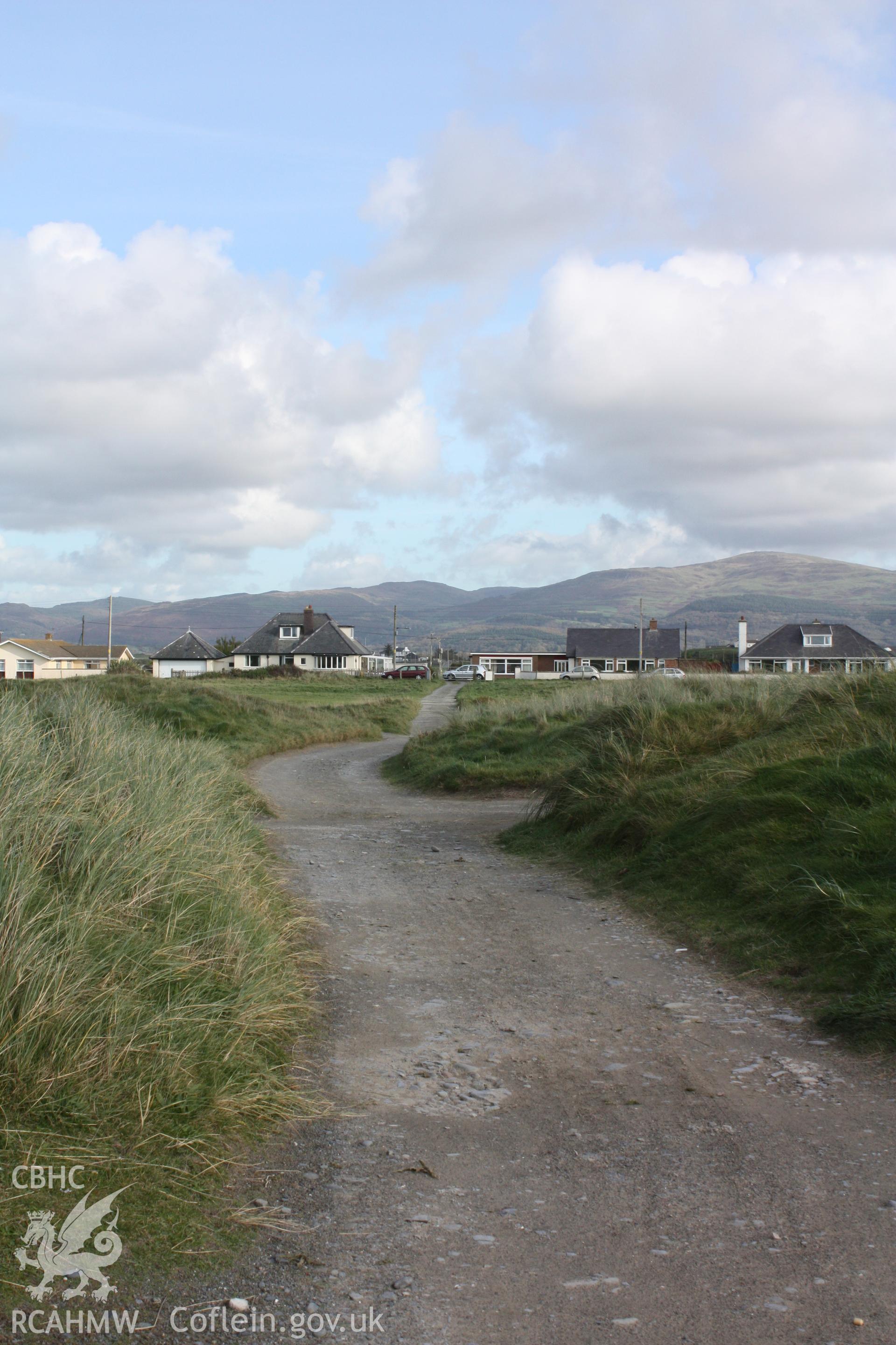 Military access track to camera observation post and associated BCF hut on golf course looking eastwards towards village centre.