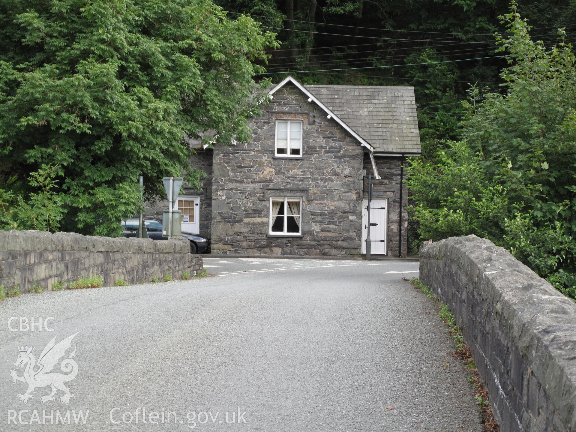 View of Maentwrog Bridge roadway and Tollgate Cottage from the northwest, taken by Brian Malaws on 05 August 2009.