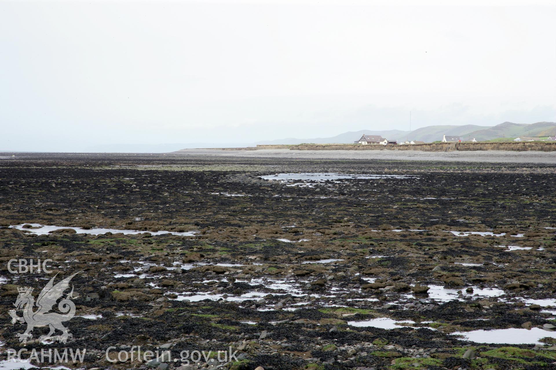 View of fish trap in centre background, looking north.