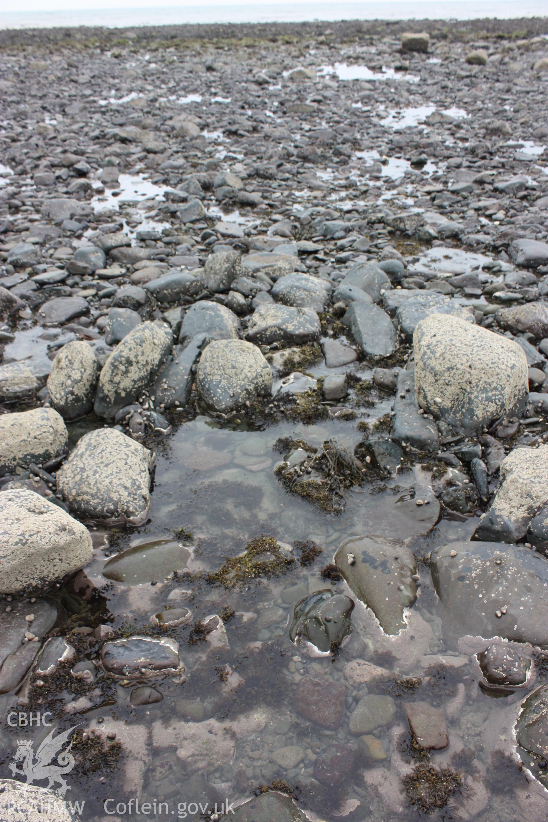 Centre of fish trap arm. Well preserved cod end or sluice, looking west.