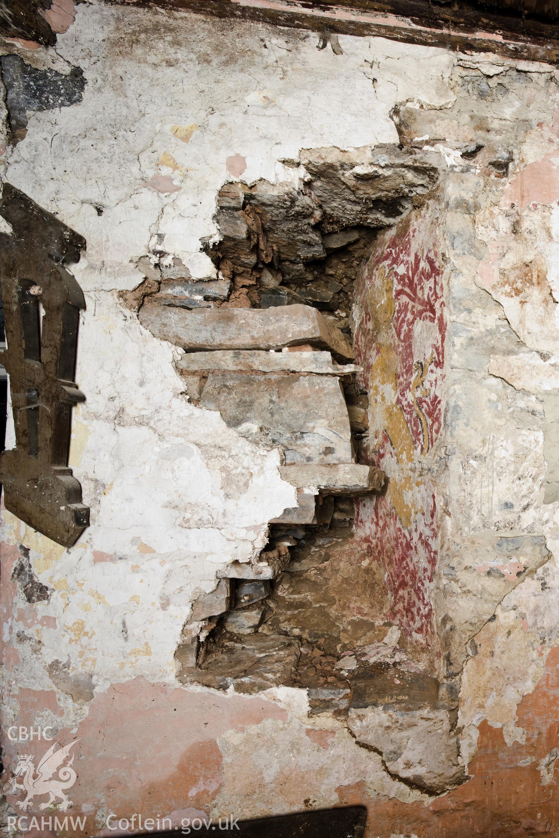 Newly exposed wall painting in window reveal, prior to stone removal.