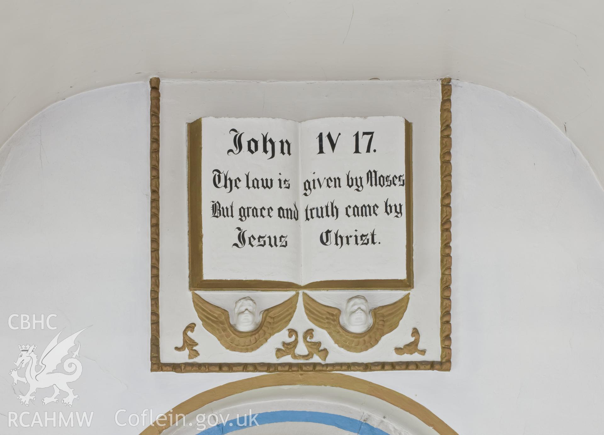 Plaster relief over altar.