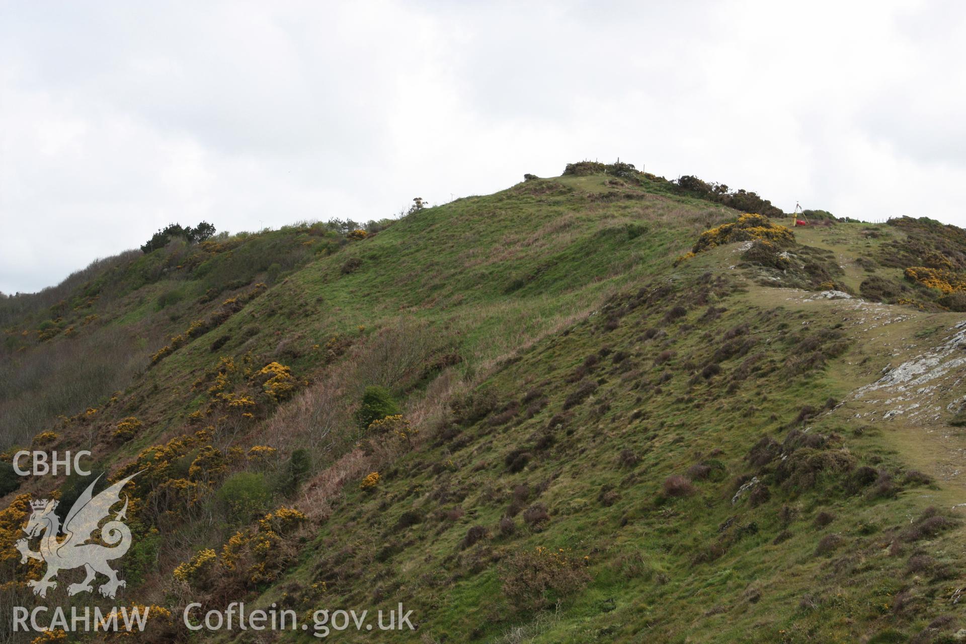 Looking north-east to the Gribin Ridge Fort, showing the terrace defining one side of the fort together with a series of platforms cut into the hill slope.