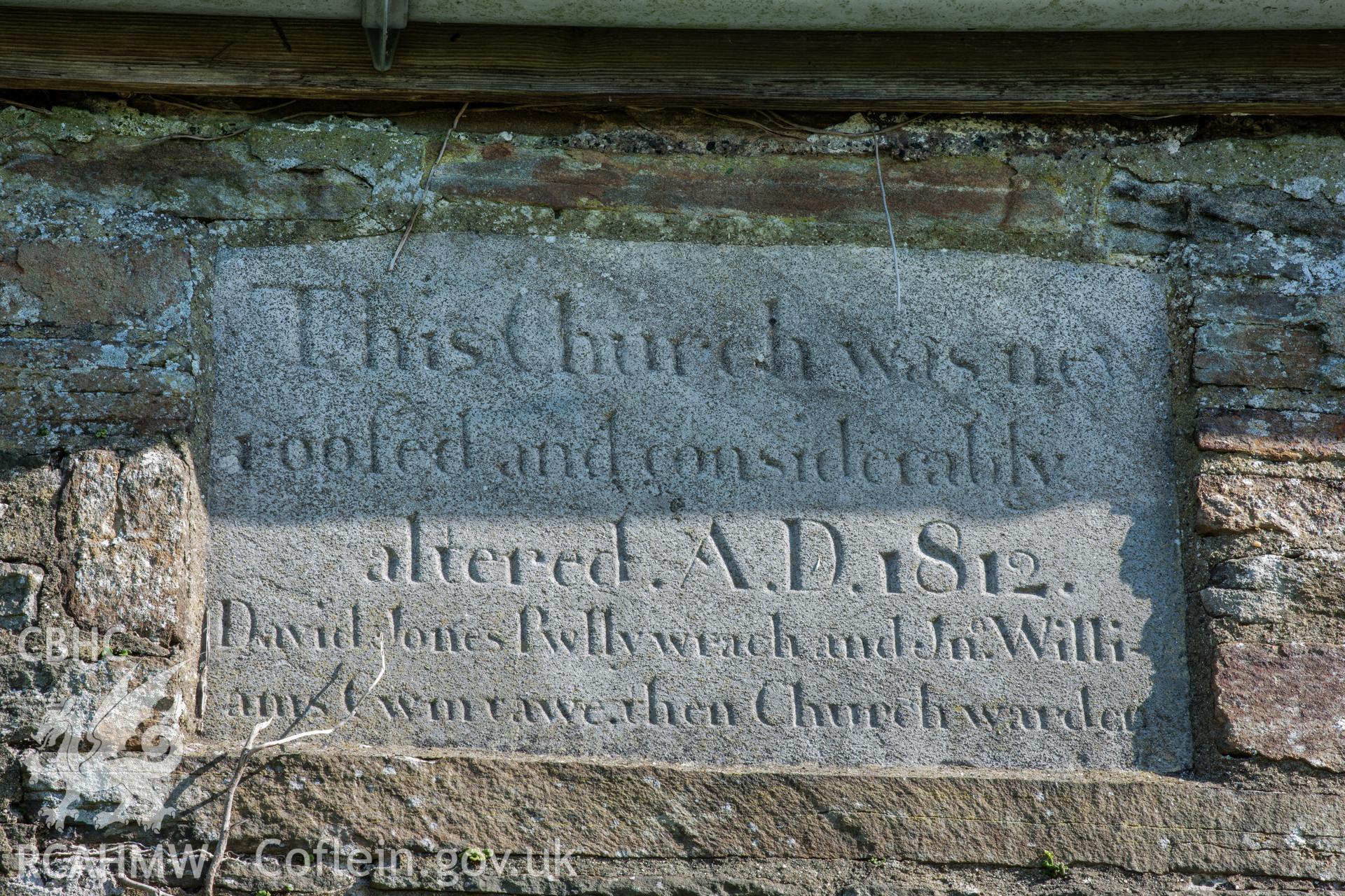 Plaque in south wall commemorating re-build