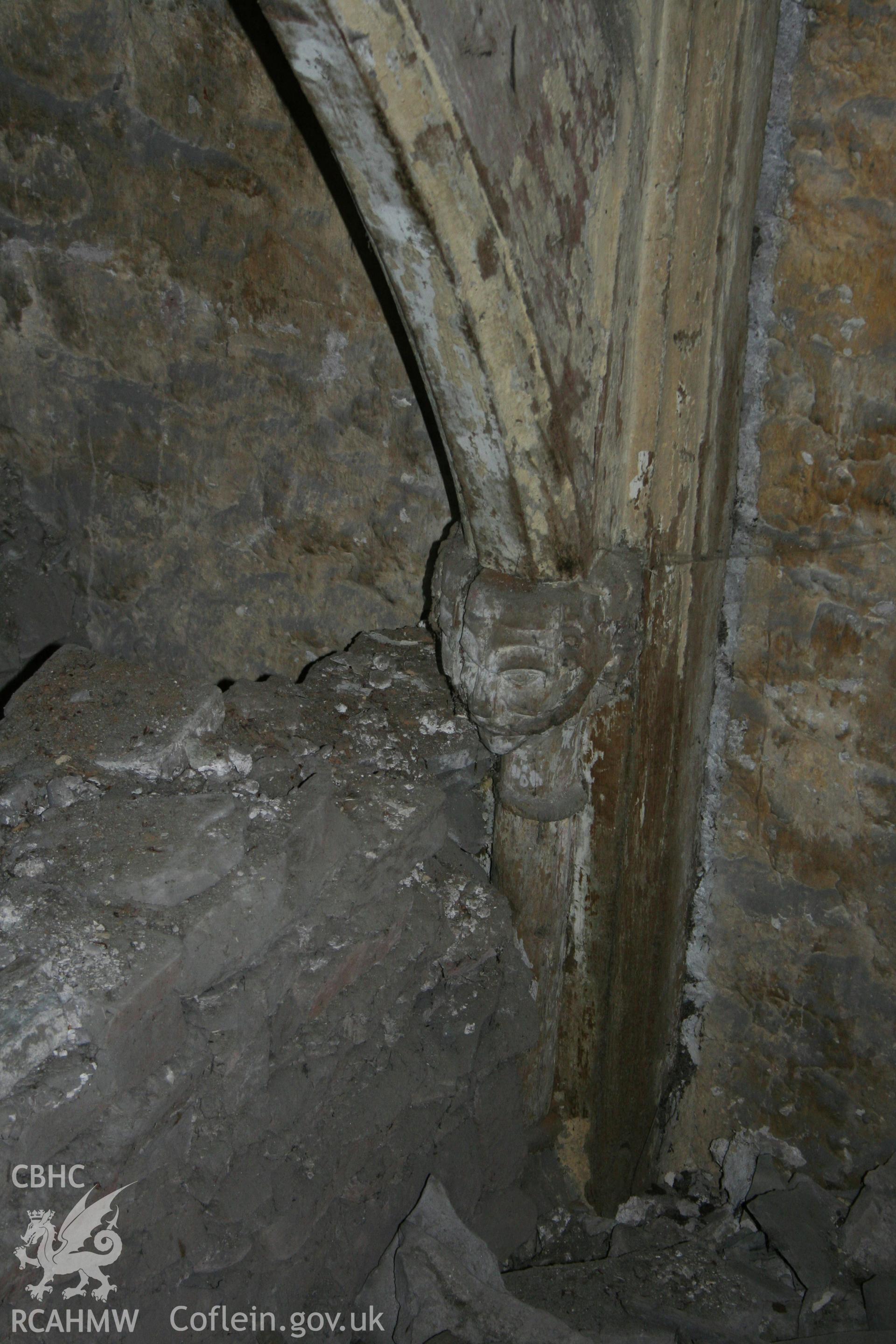 Carved corbel at foot of arch brace