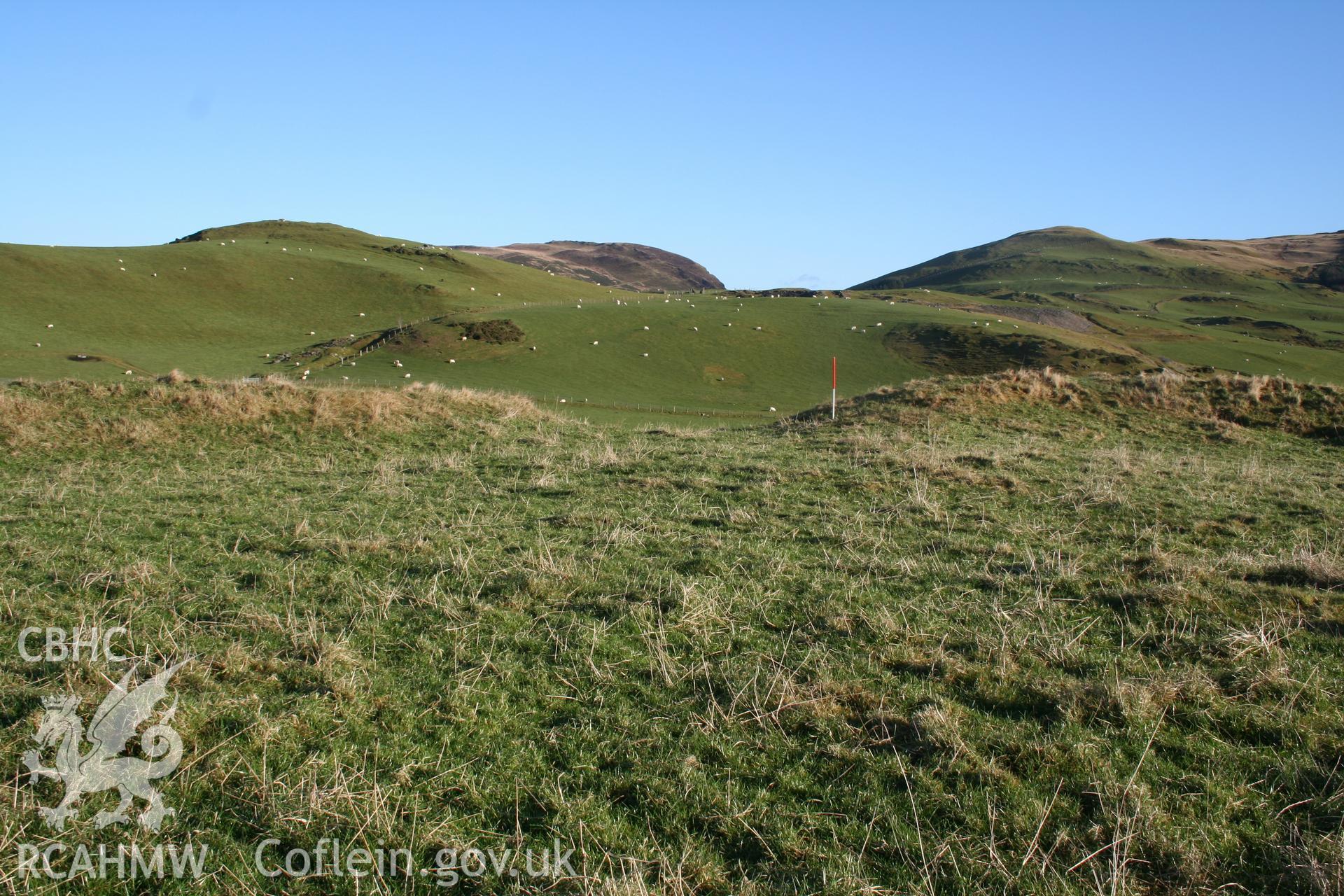 View of entrance, on the north-west, from the south-east; 1m scale.