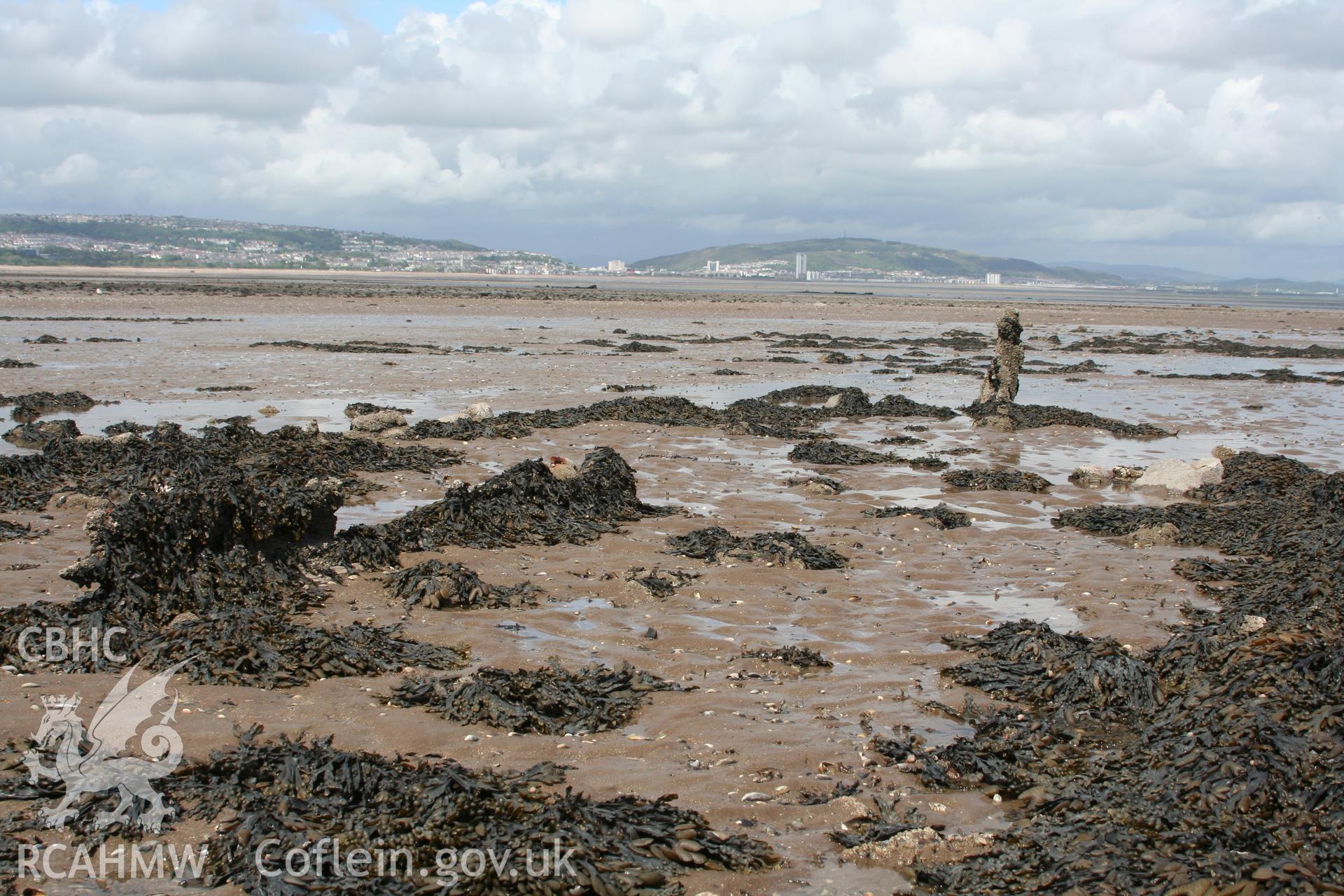 Wreck, looking east, bow towards stern, showing the port and starboard quarter-aft. In foreground remains of the keelson and metal fitting, in background, remains of the stern post.