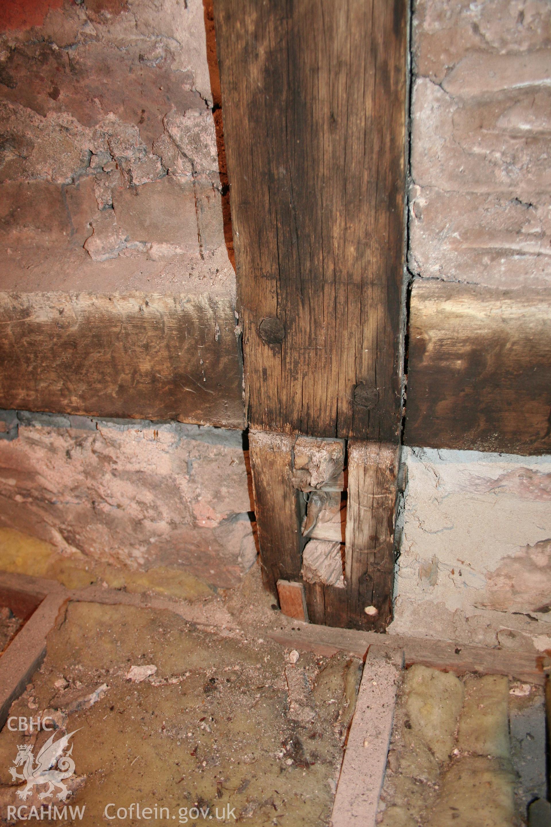 Remaining mortice and pegs once used to support a collar purlin