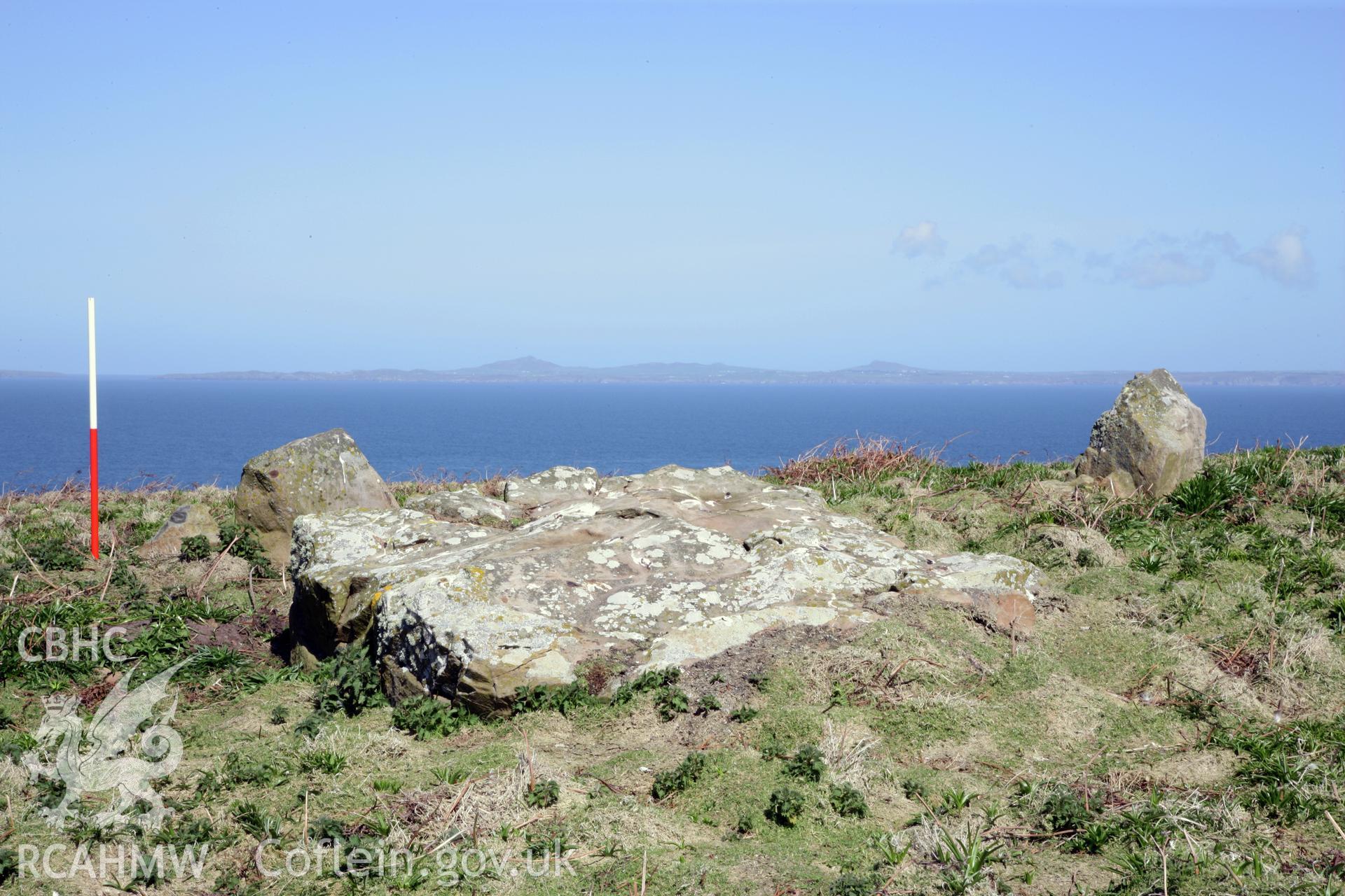 Stone pair and earthfast slab near to North Stream on Skomer Island. Looking north across St Brides Bay to the peaks of St Davids Head.