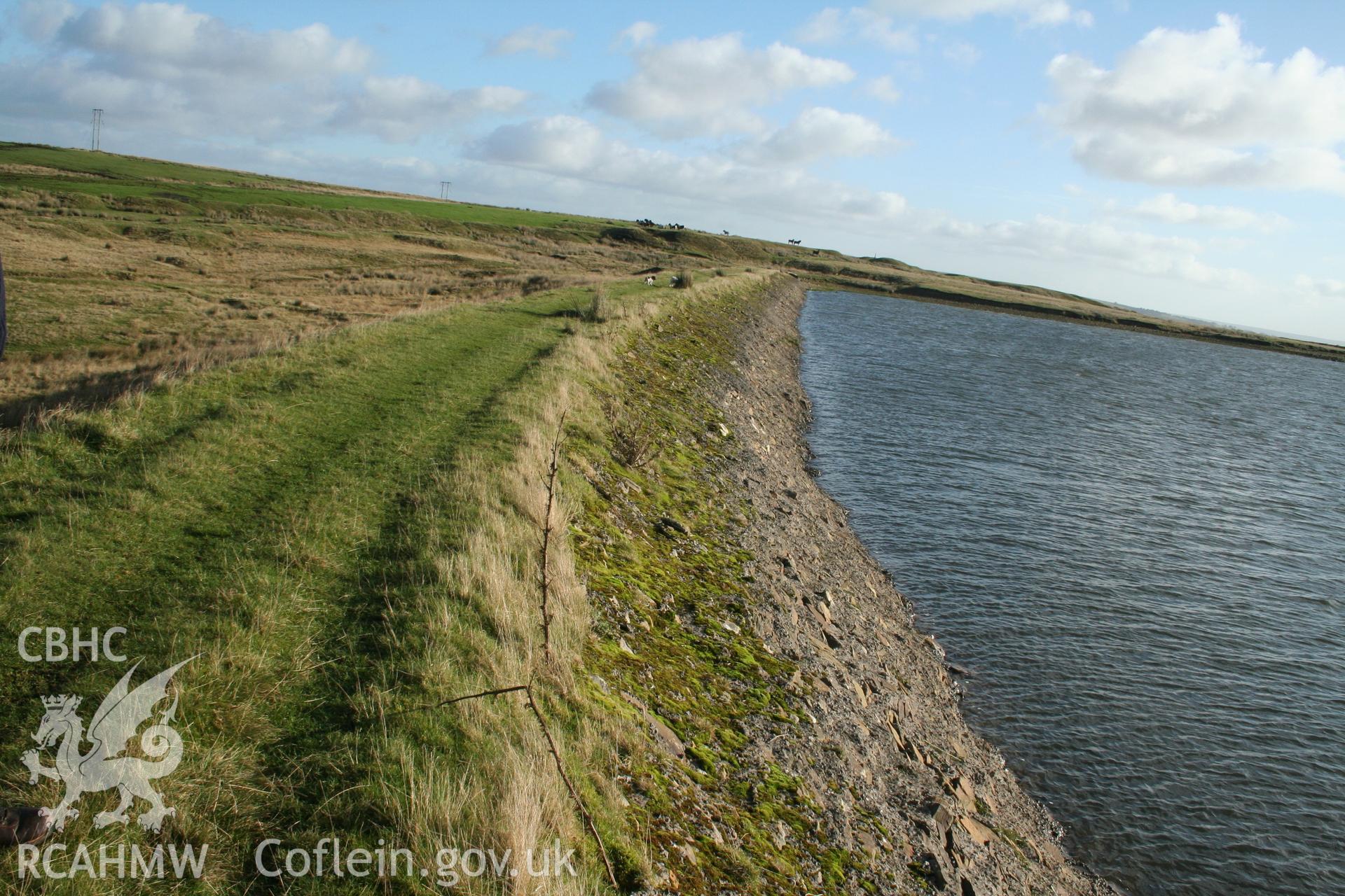 Digital image of Rhaslas Pond and the surrounding area: View of the north dam, looking east.