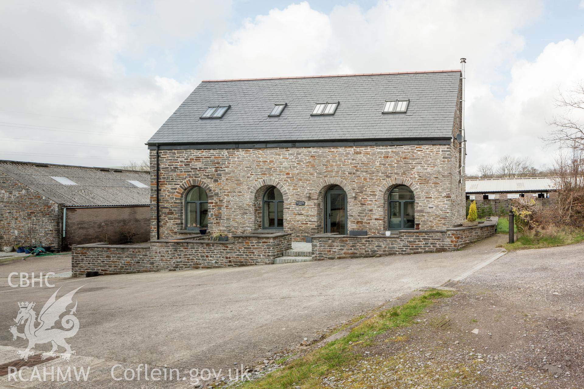 Exterior of modern conversion of associated barn from the south