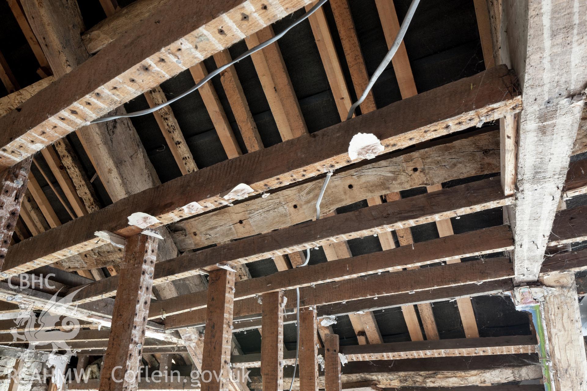 First floor southeast end, peg holes in purlin