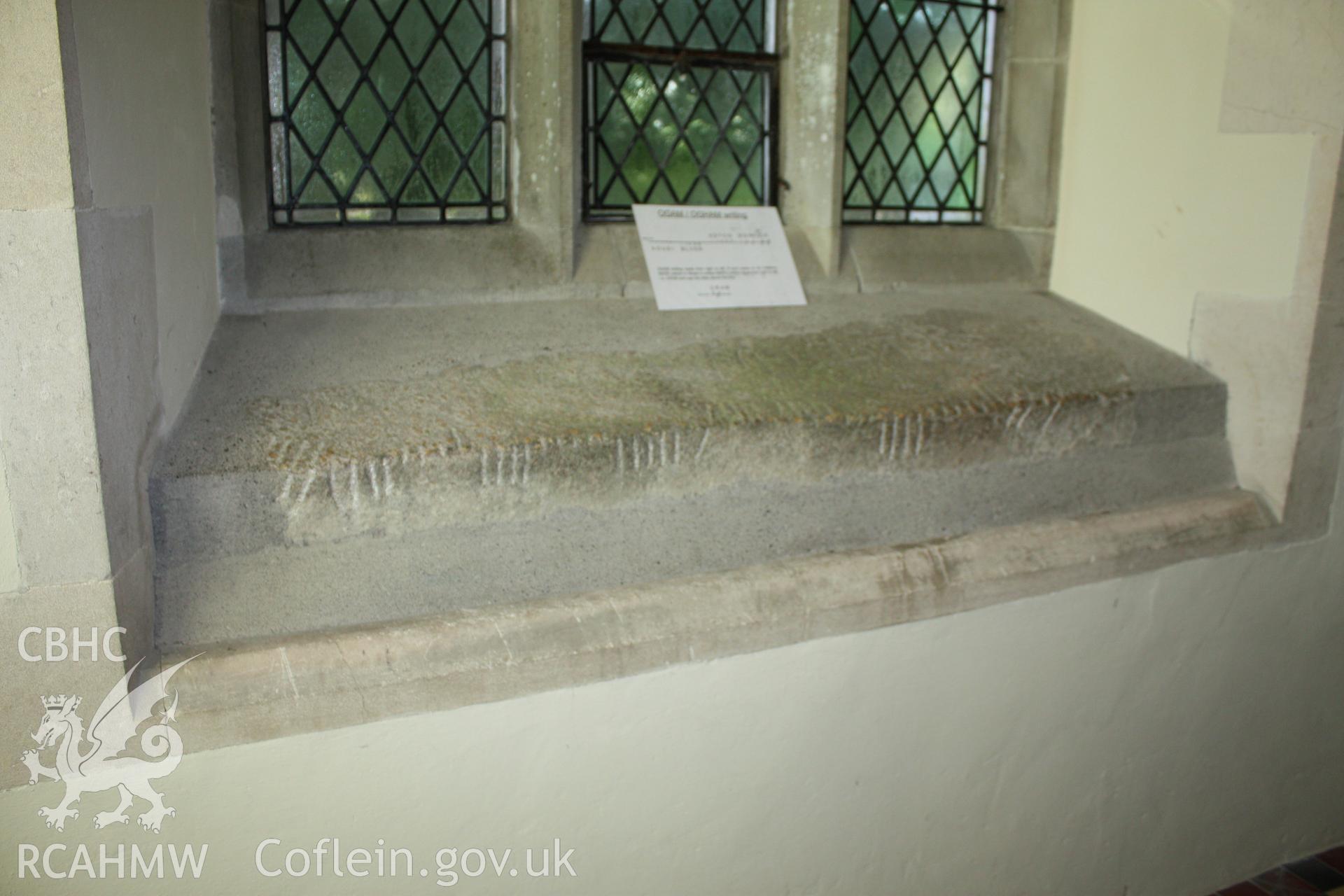 St Brynach's Church, Nevern, Pembrokeshire. May 2010. Ogam inscribed stone reused in south aisle window.