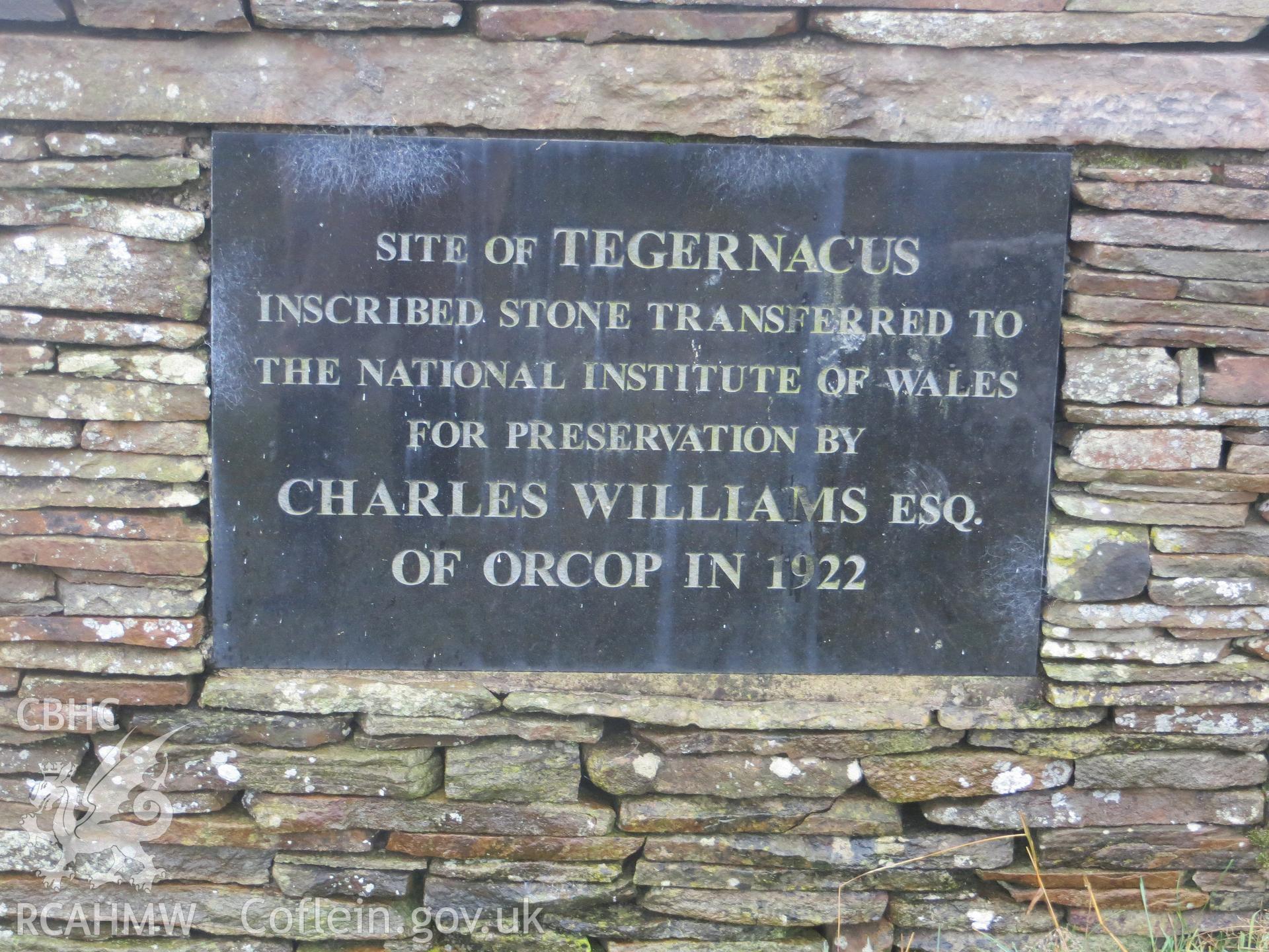 Plaque commemorating re-location of stone.