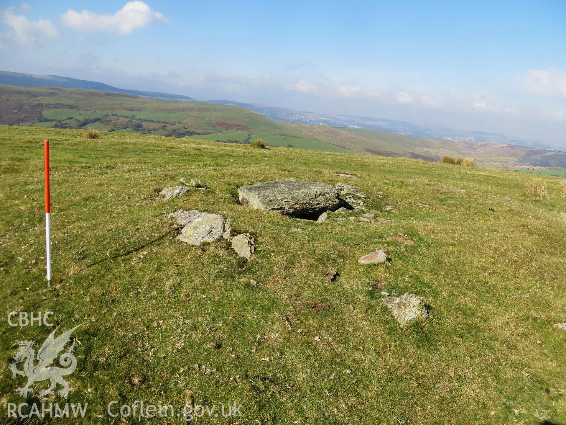 View from the north-west showing cist and kerbstones; 1m scale.