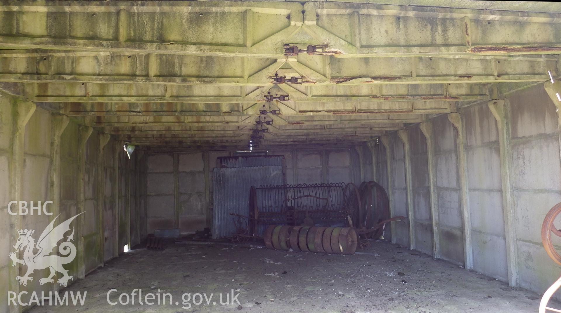 Interior view of BCF hut showing the iron fastenings locking the two halfs of central spans of the roof together