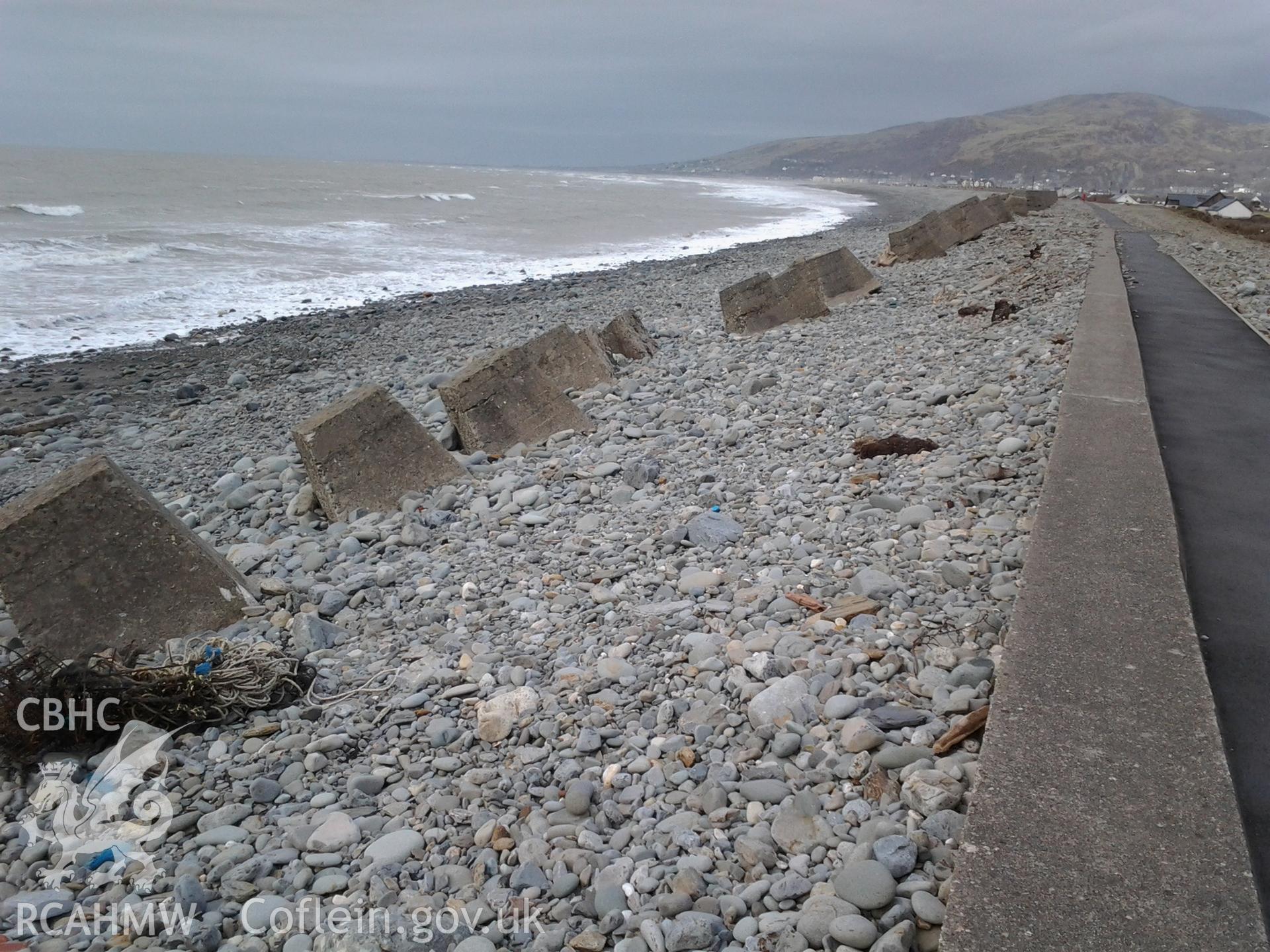 Slumping of the line during to changes in the profile of the shingle ridge in response to storm waves