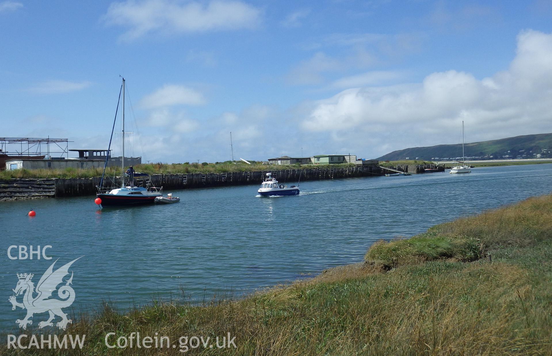 View of the BCF hut from the east bank of the Leri, adjacent to green caravan and small landing pontoon (BCF Hut 408425 to left of view)