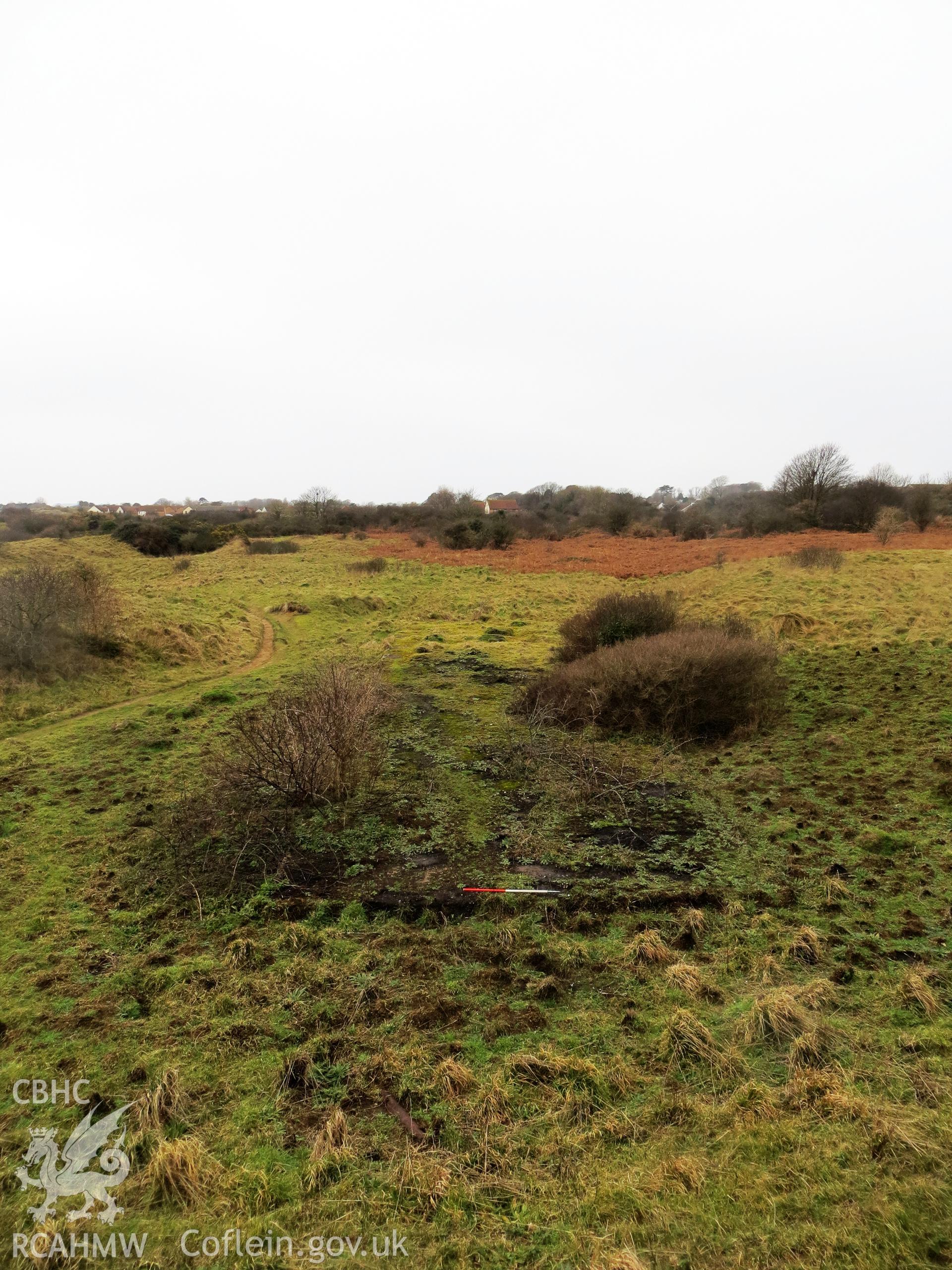 View of platform from adjacent rifle mound on the east (NPRN 419939); 1m scale.