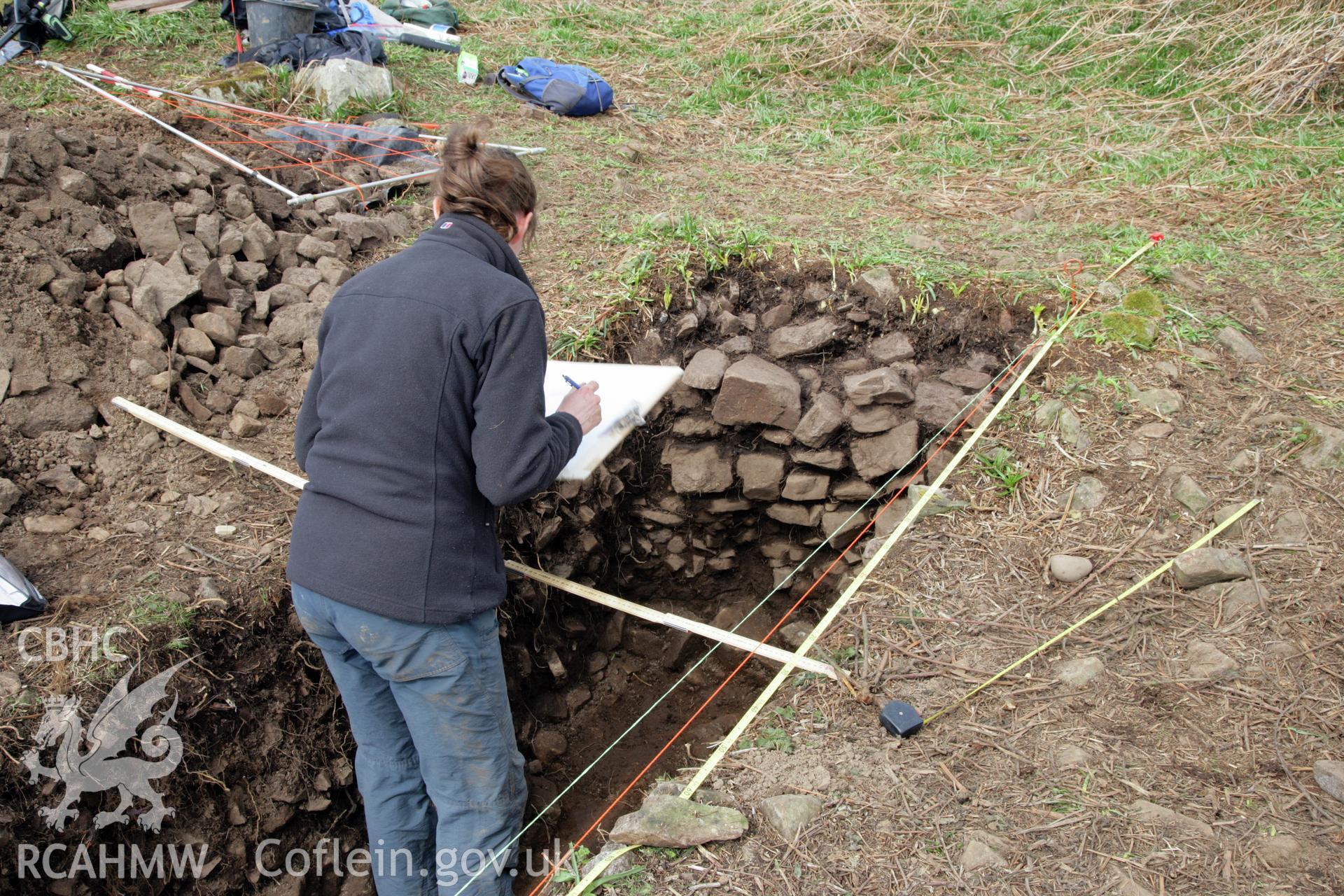 Skomer Island excavation of a burnt stone mound, Hut Group 8. Post excavation recording by L. Barker