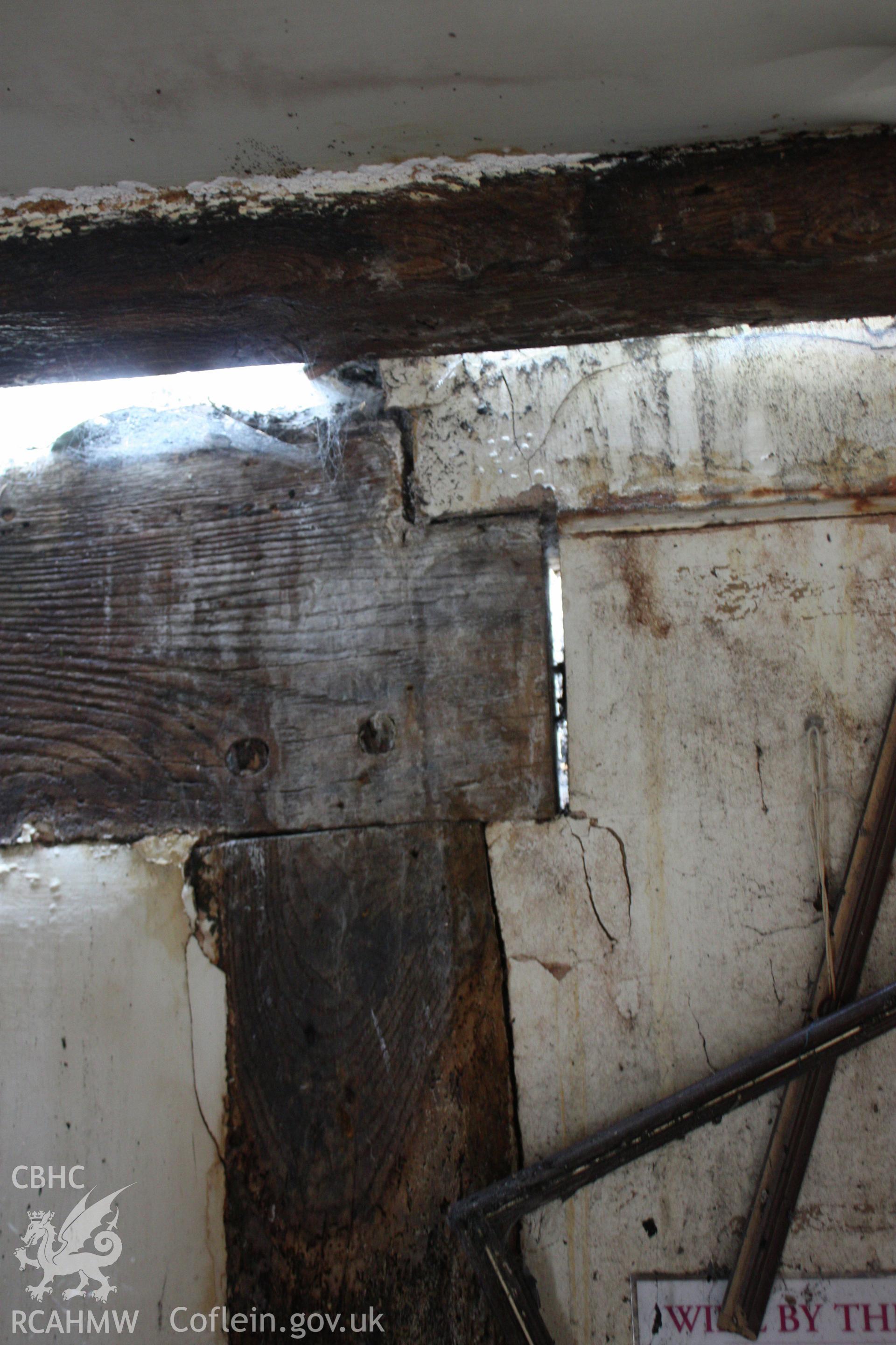 Chamfered doorway to stud in partition.