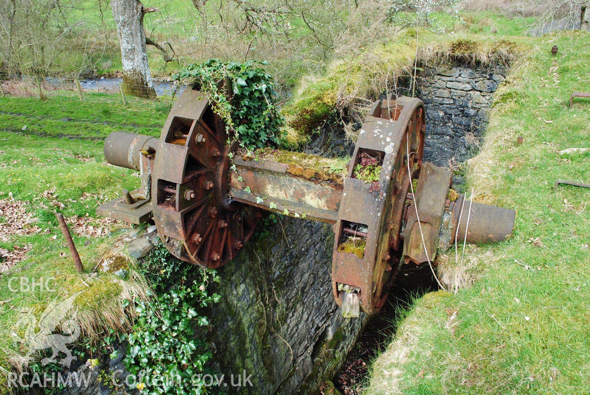 Close up view of metal axle of waterwheel