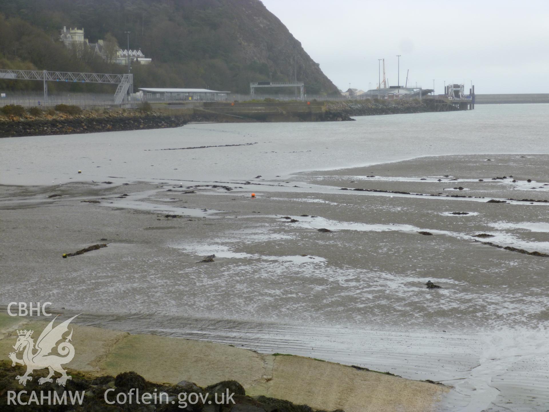 Hook of  fishtrap viewed from top of sea defences, with a second phase possibly viewable inthe centre middle ground (ground moorings of small craft in foreground).