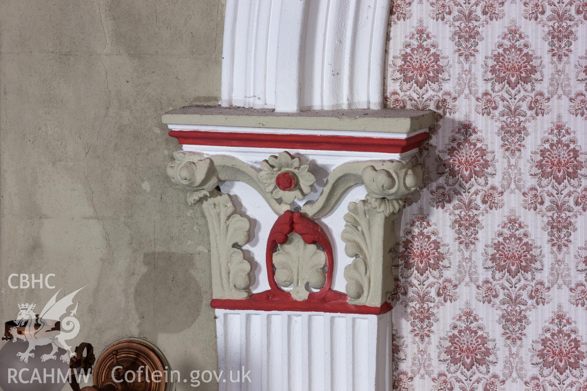 Detail of decoration of capital over sedd fawr