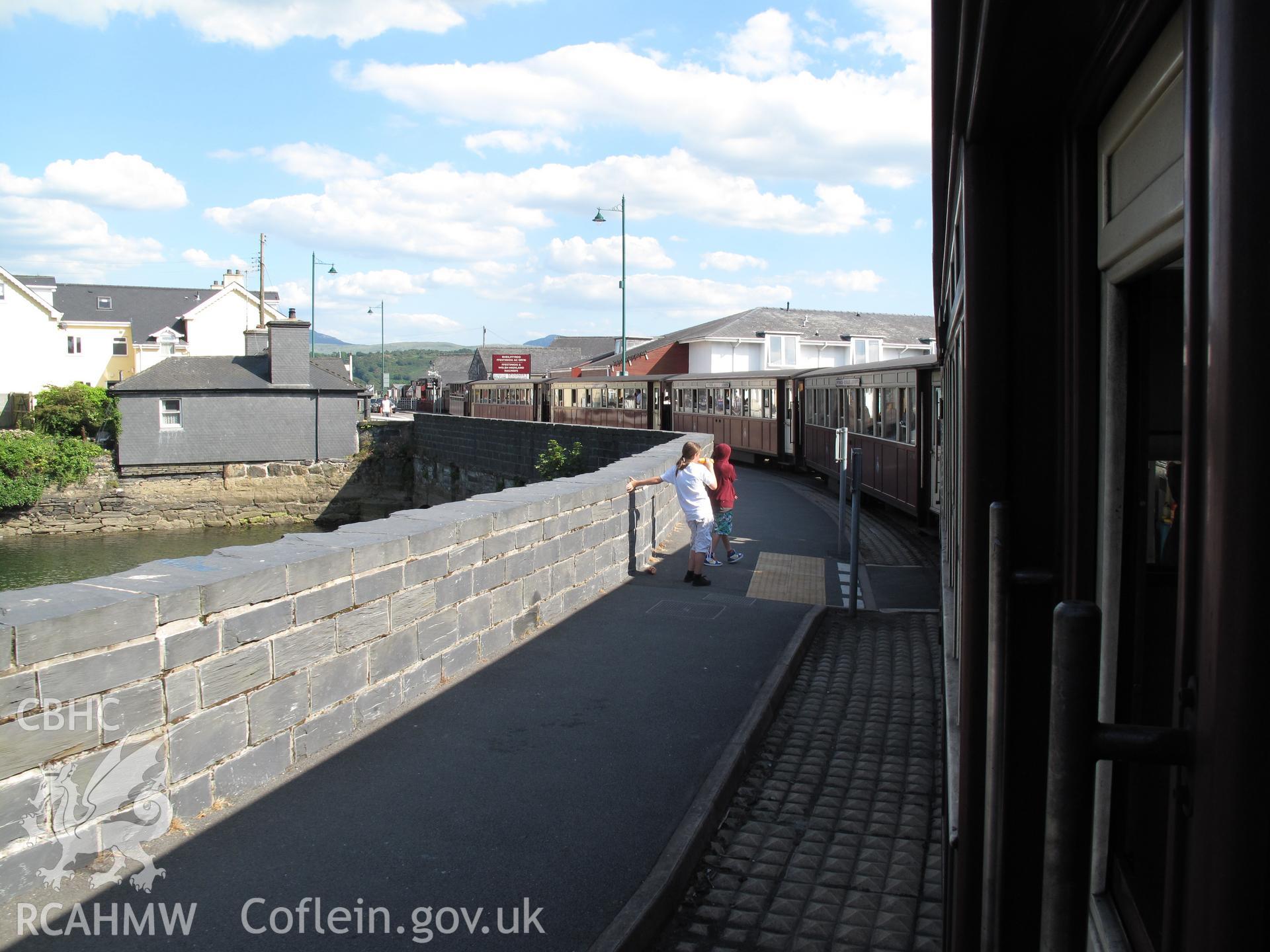 Welsh Highland Railway train crossing Britannia Bridge, Porthmadog.