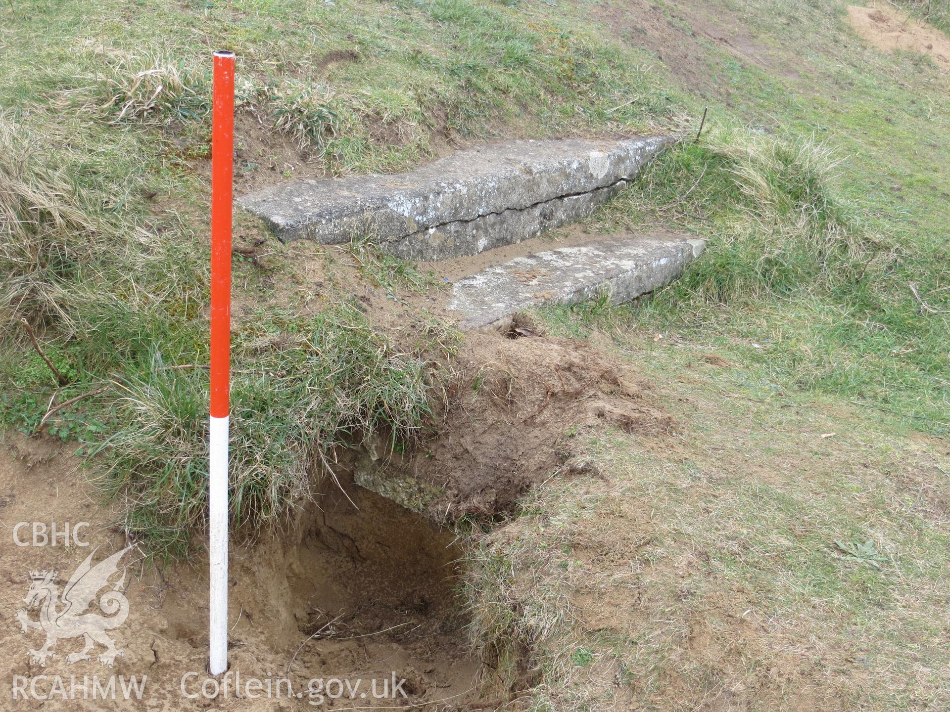 Buried step exposed by burrowing; 1m scale.