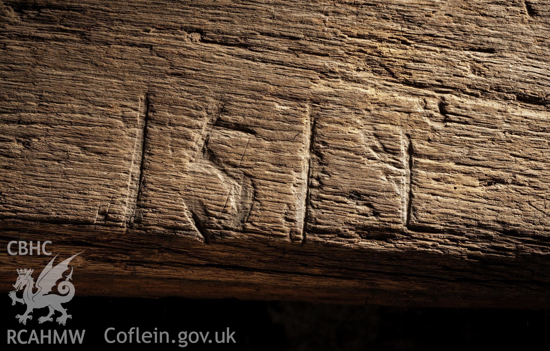 Detail of date inscription on fireplace bressummer.