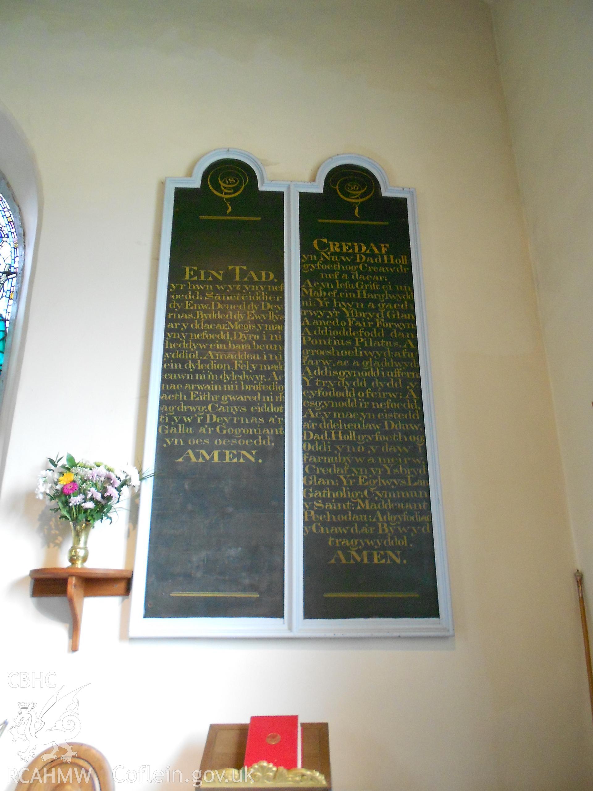 Board to right of altar showing Lord's Prayer and another prayer in Welsh