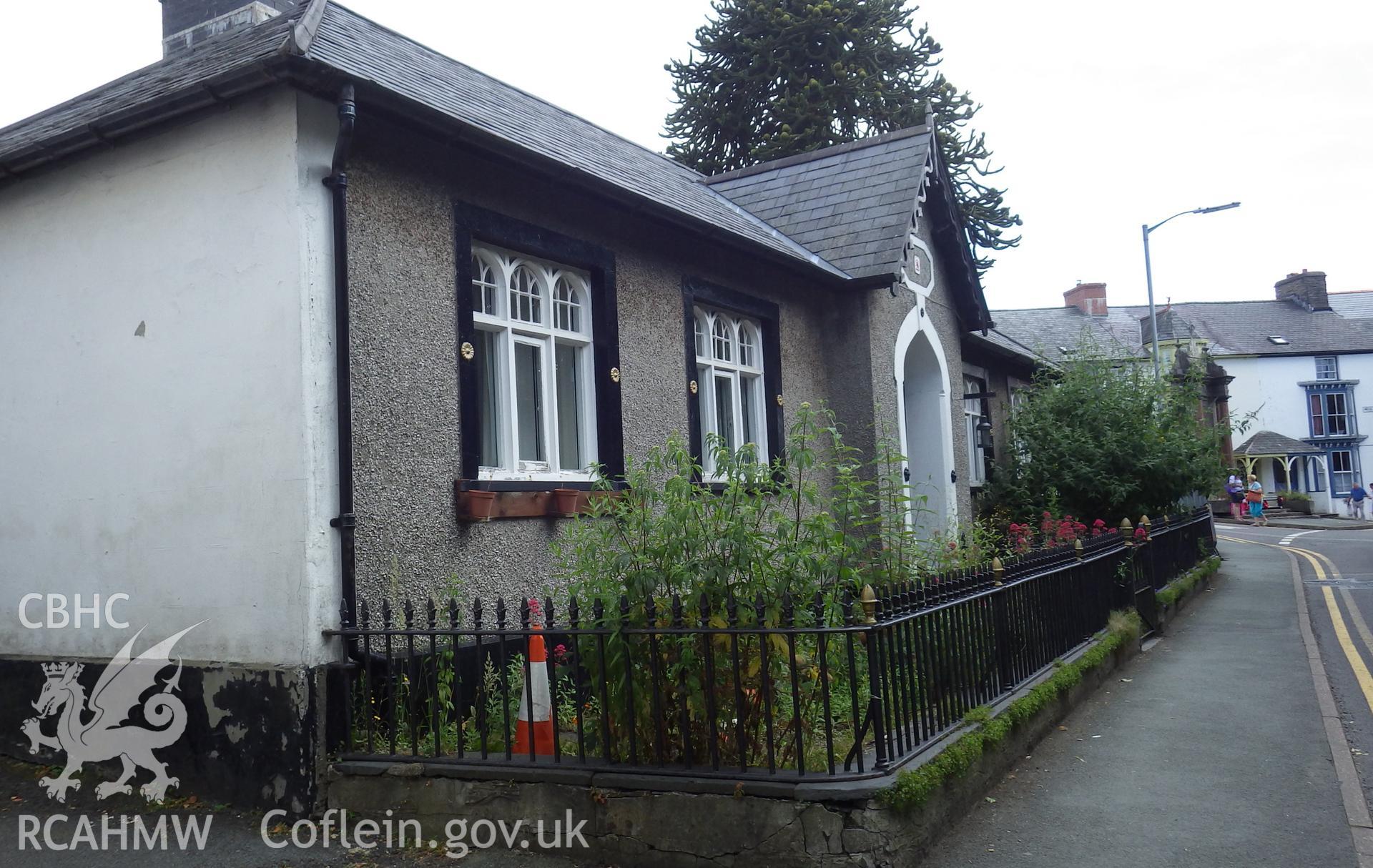 Exterior viewed from road (from northwest) with Machynlleth War Memorial just visible in the far distance