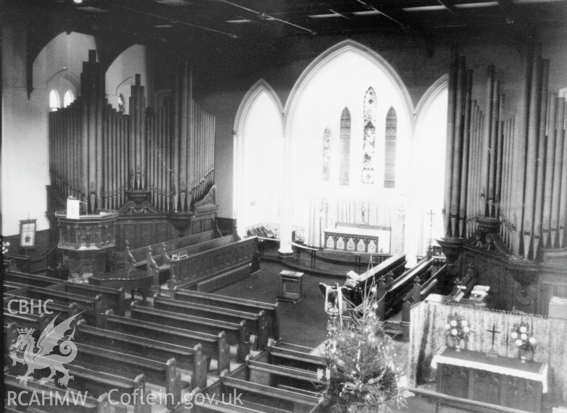 Interior black & white copy of early photograph taken from the balcony