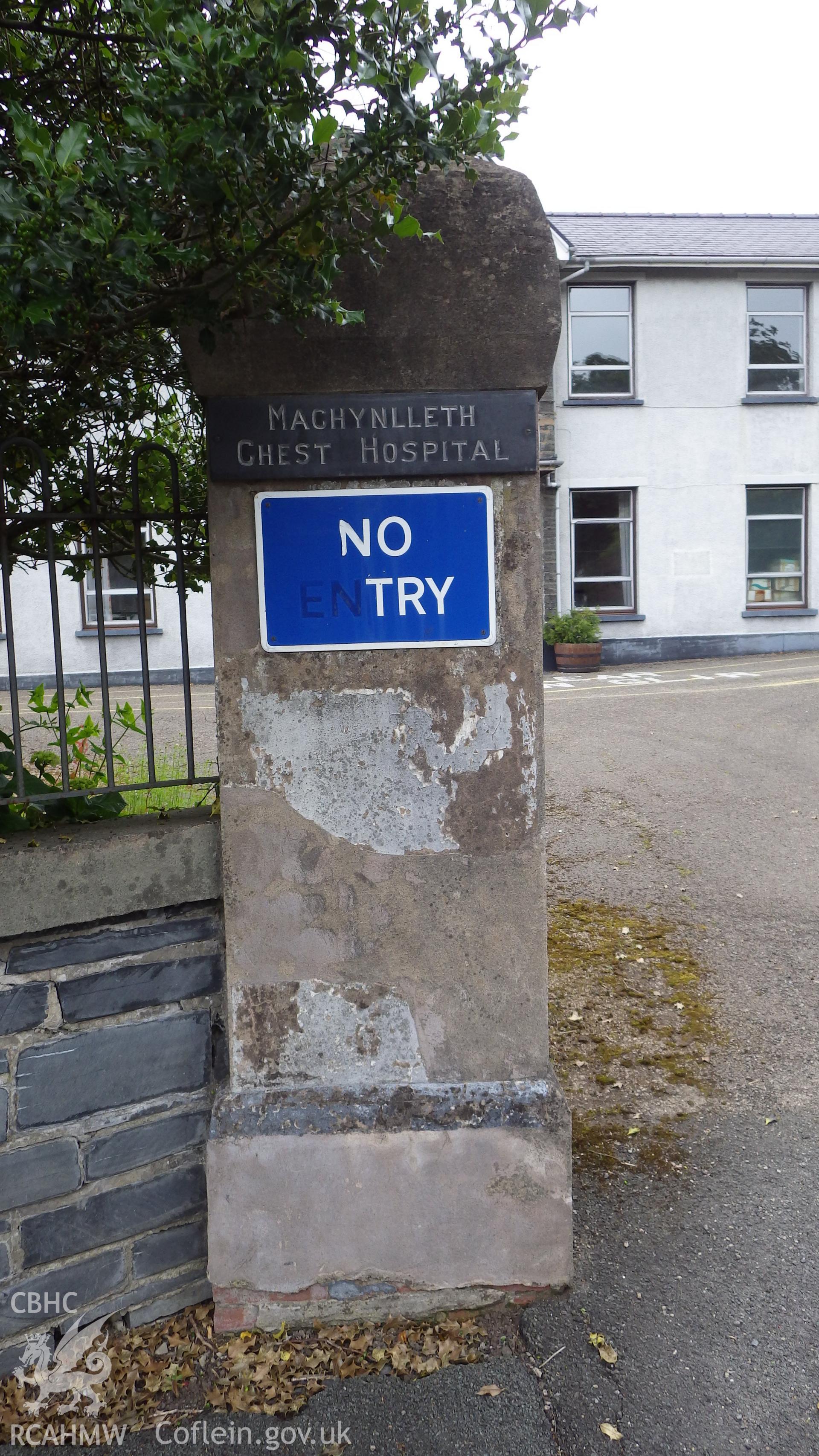 Gate pier showing the slate plaque naming Machynlleth Chest Hospital