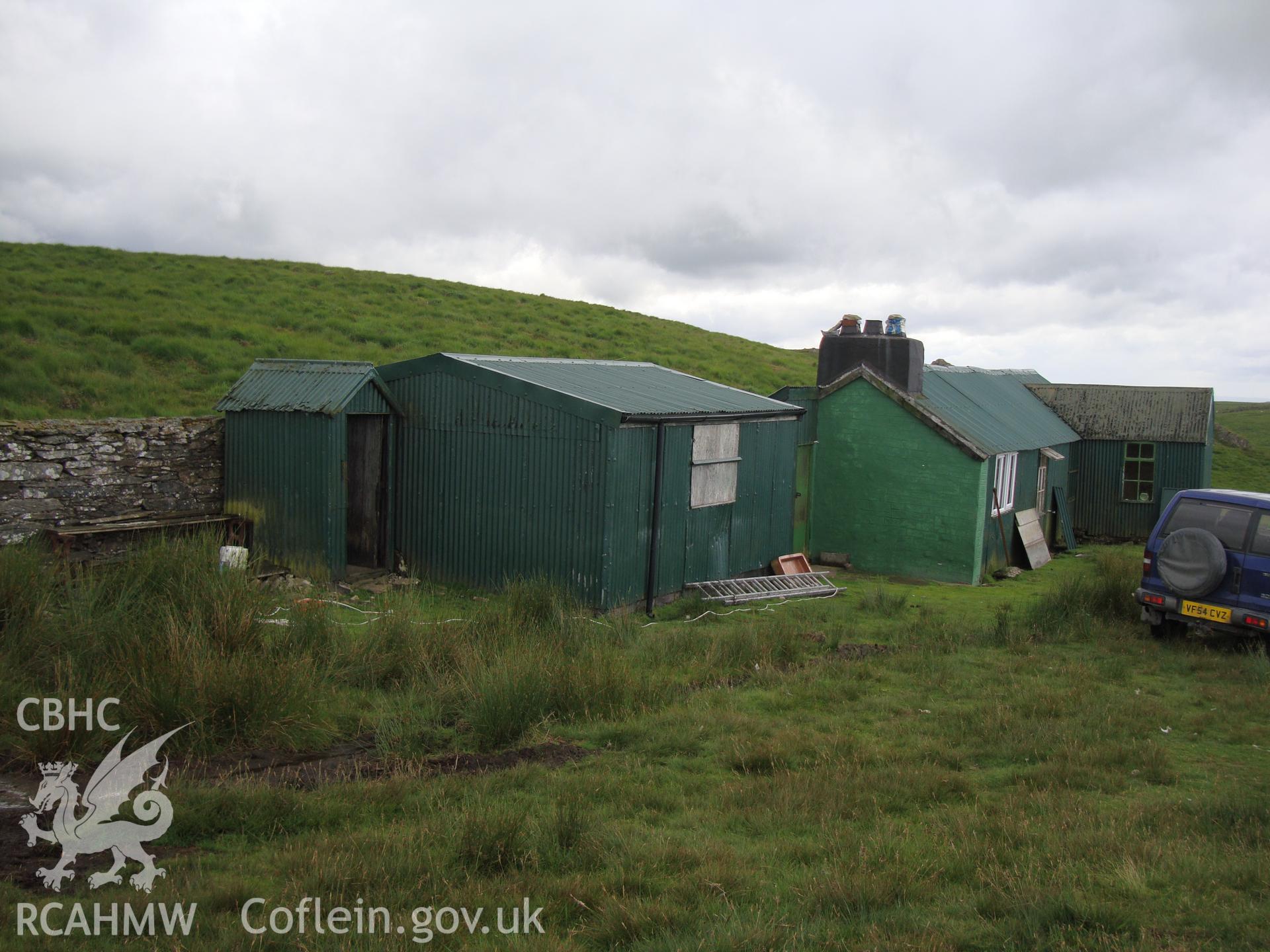 Shed, looking southwest, with hut NPRN 503506 beyond.