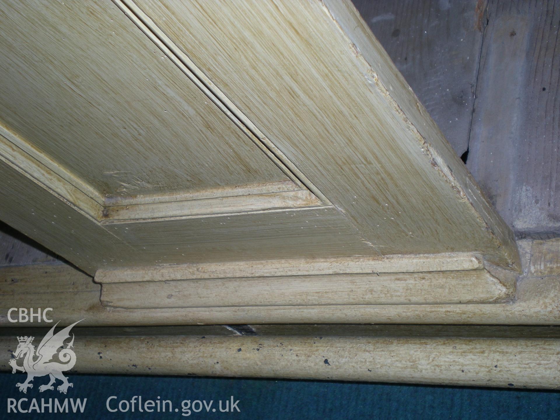 Colour photograph showing detail of the pews.