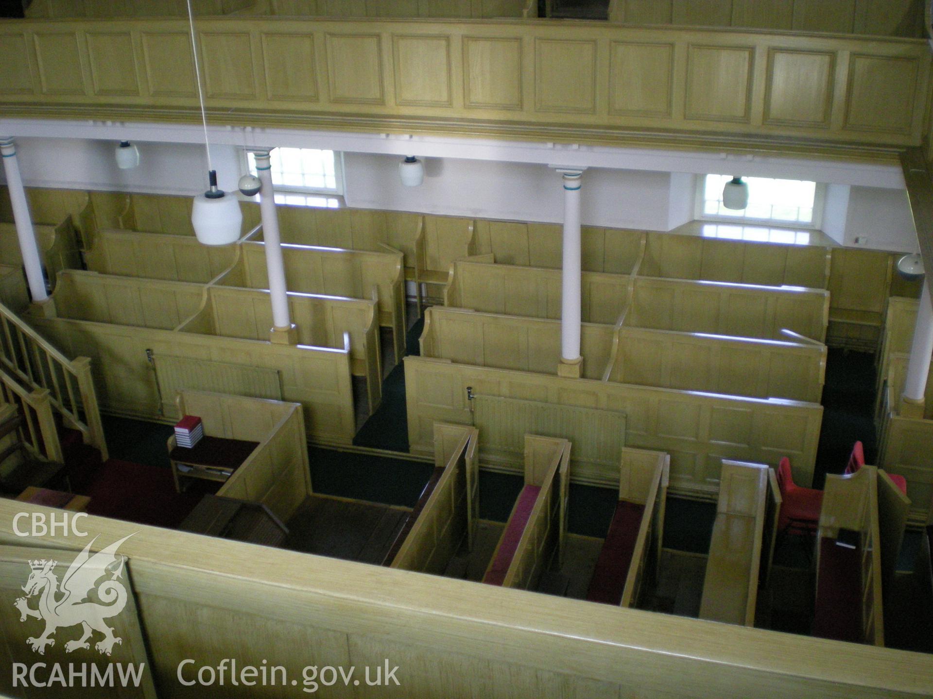 Colour photograph showing interior view looking down from the gallery.