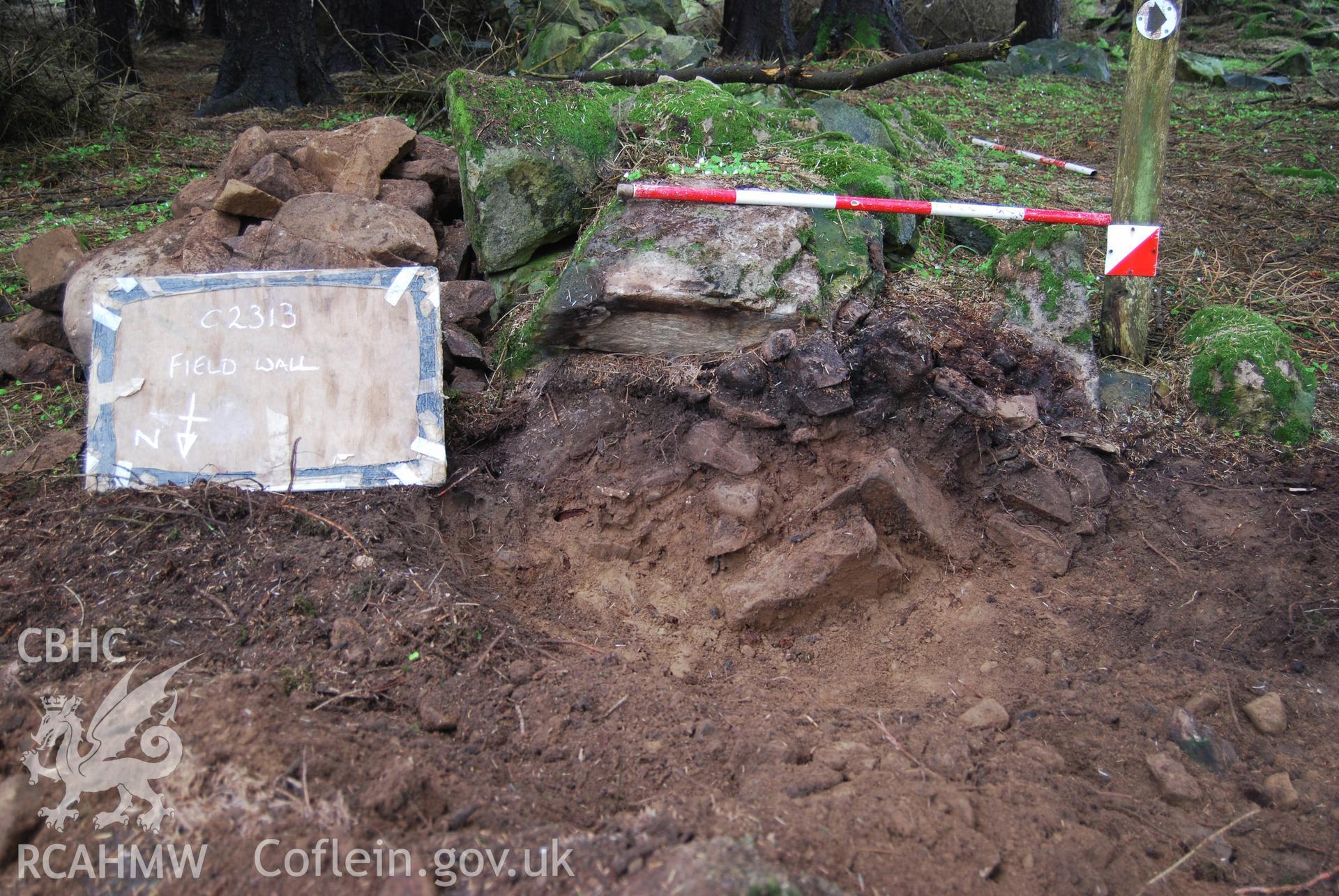 Photo showing 'Post-ex section of wall' from Archaeological Watching Brief of Nant Gwrtheyrn Lower Car Park, Nant Gwrtheyrn, Gwynedd produced by Gwynedd Archaeological Trust in 2013, Project No. G2313, Report No.1208.