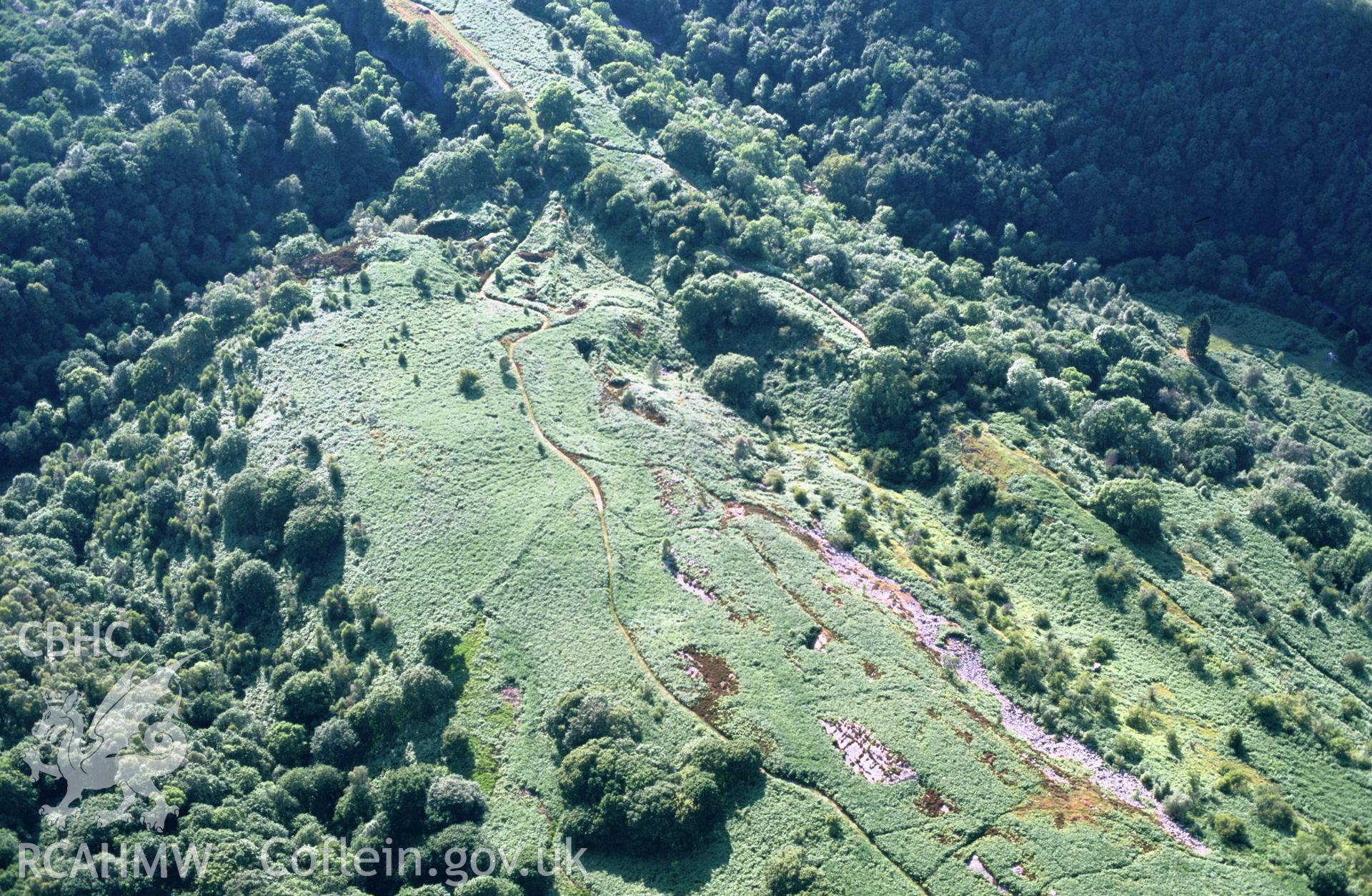 Slide of RCAHMW colour oblique aerial photograph of Craig Y Ddinas Promontory Fort, Pontneddfechan, taken by T.G. Driver, 26/7/1999.