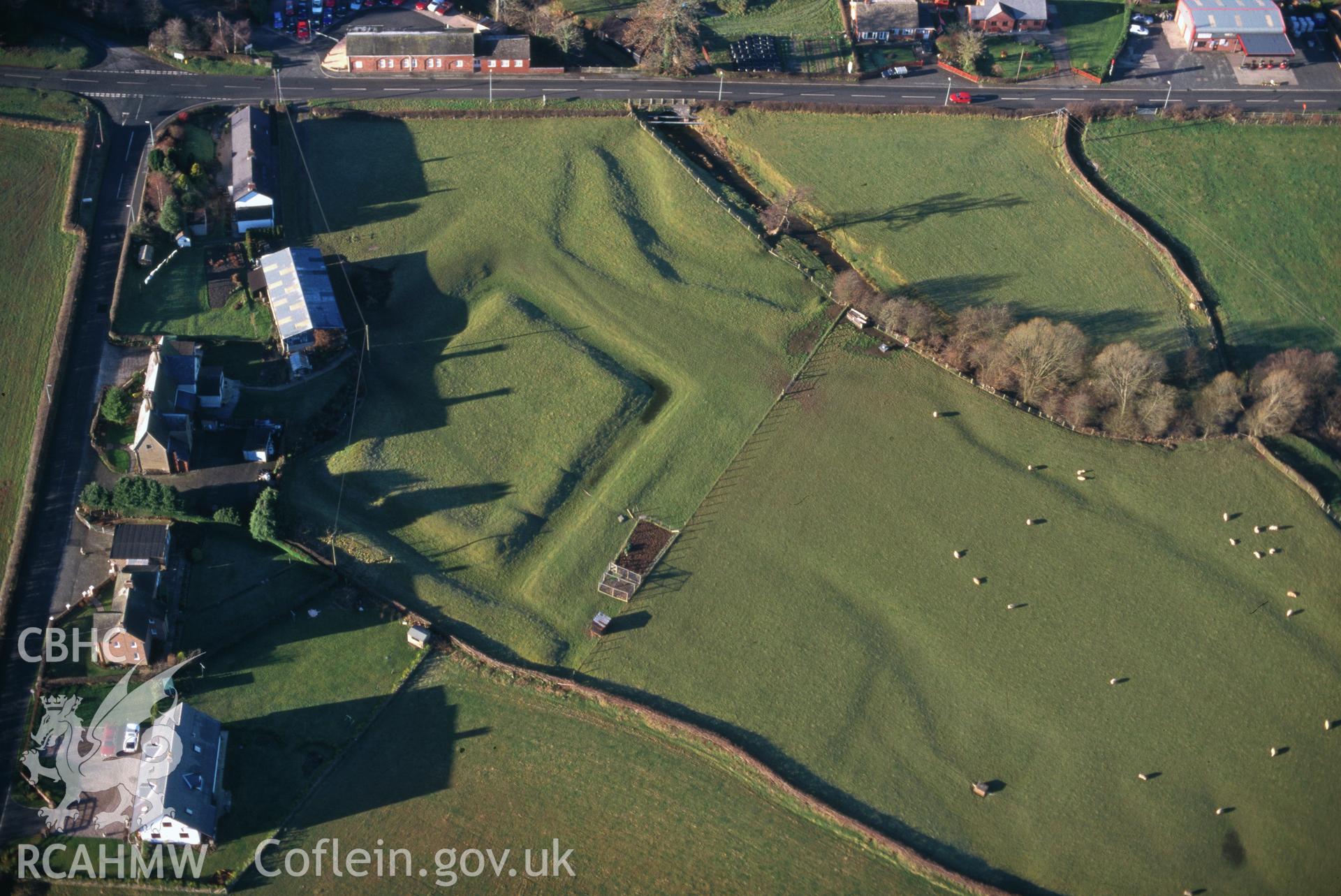 Slide of RCAHMW colour oblique aerial photograph of Tregynon, Moat, taken by C.R. Musson, 20/12/1998.