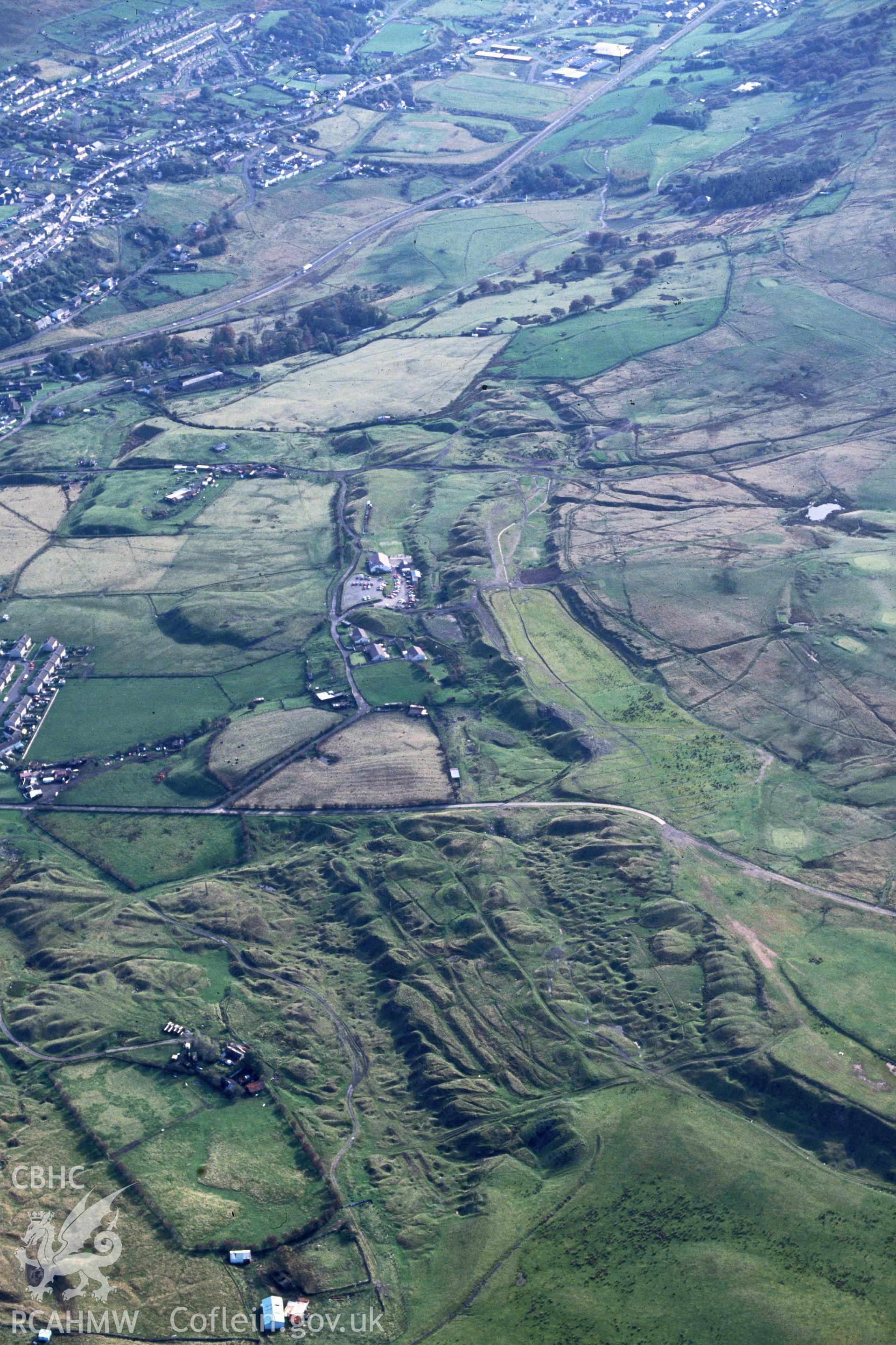 Slide of RCAHMW colour oblique aerial photograph of Winchestown Mine Workings, taken by C.R. Musson, 19/10/1992.