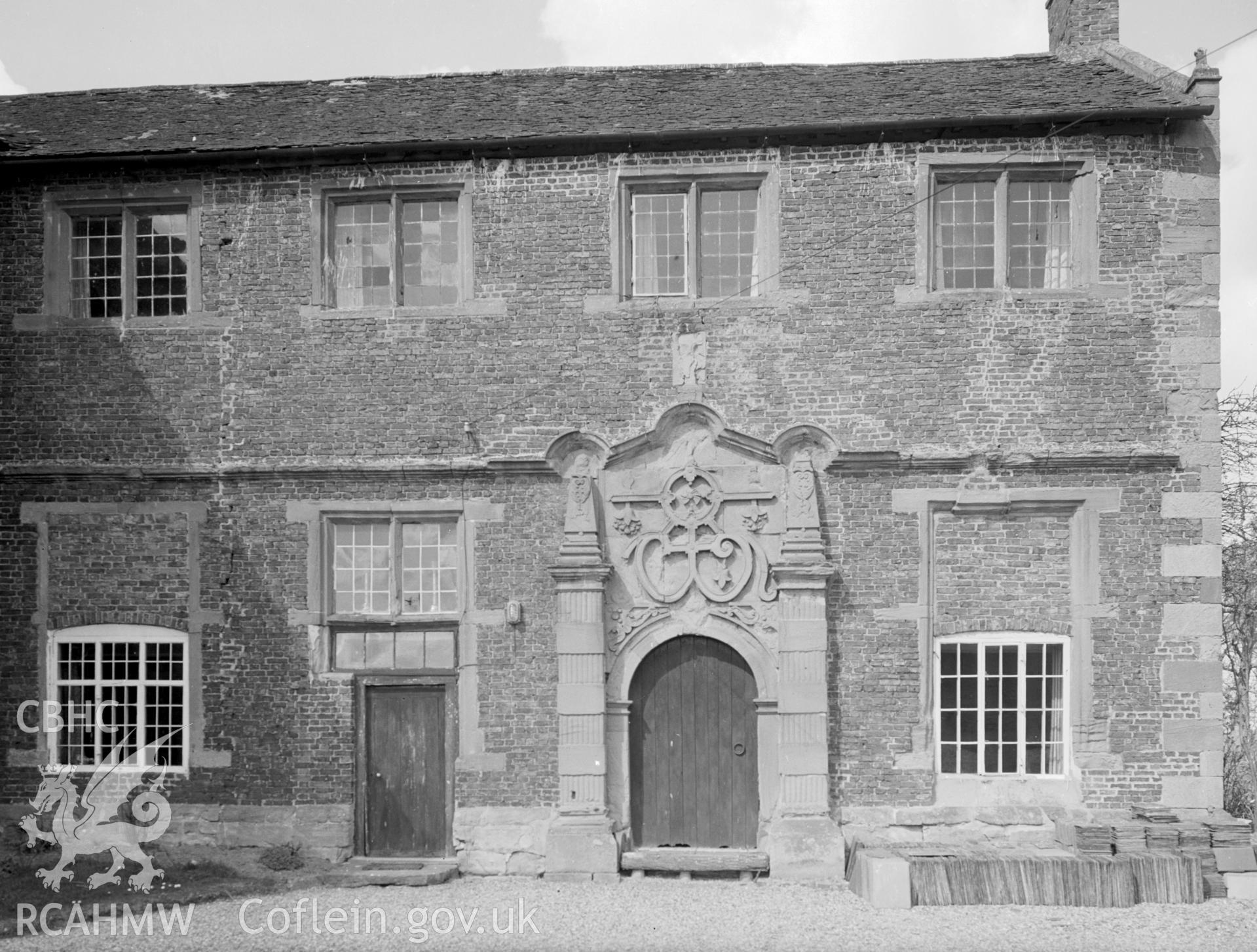 A view of the two front entrances: one is a plain rectangular doorway.