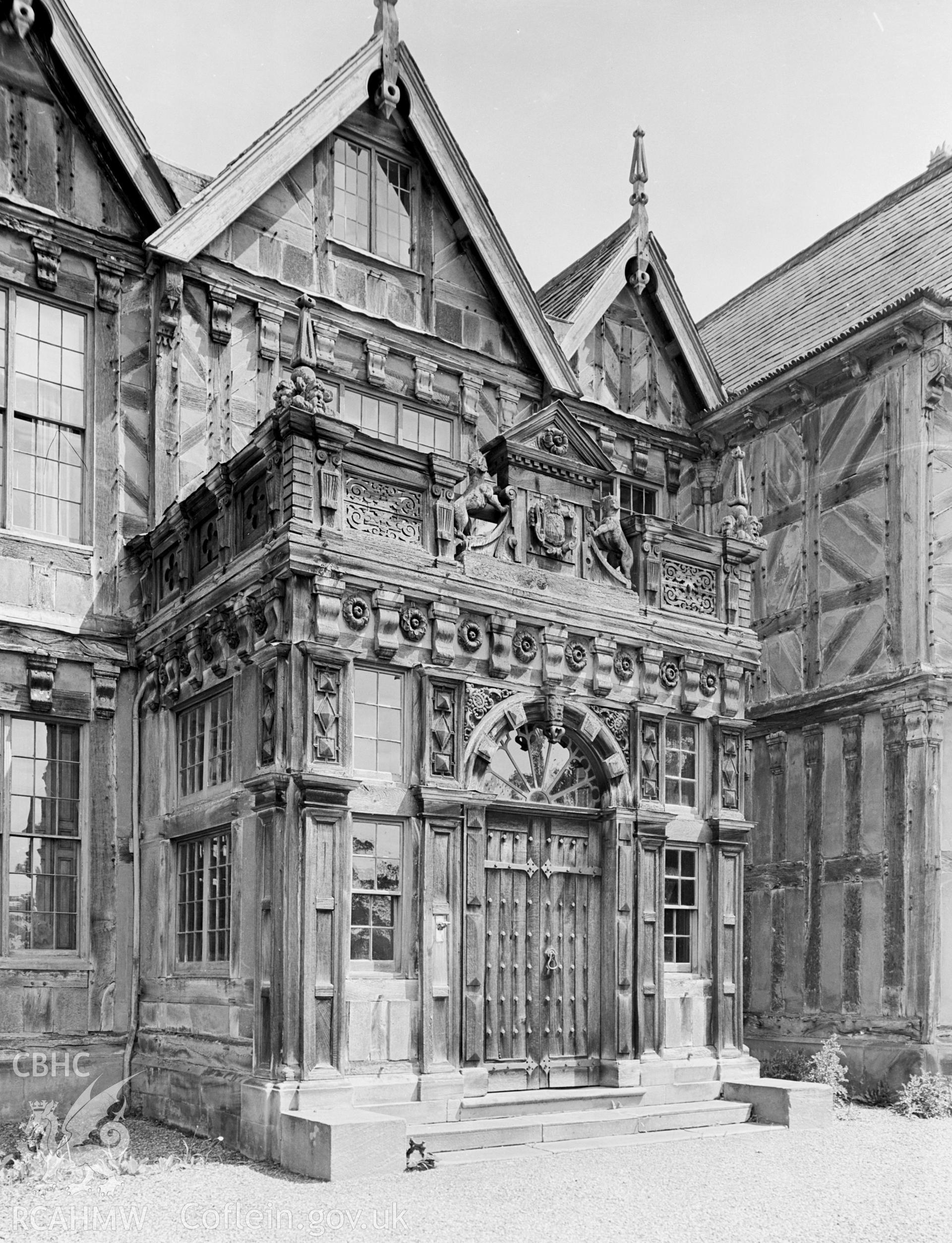 A view of a large front porch. Added on the building in 1852, appears to be mainly made of wood.