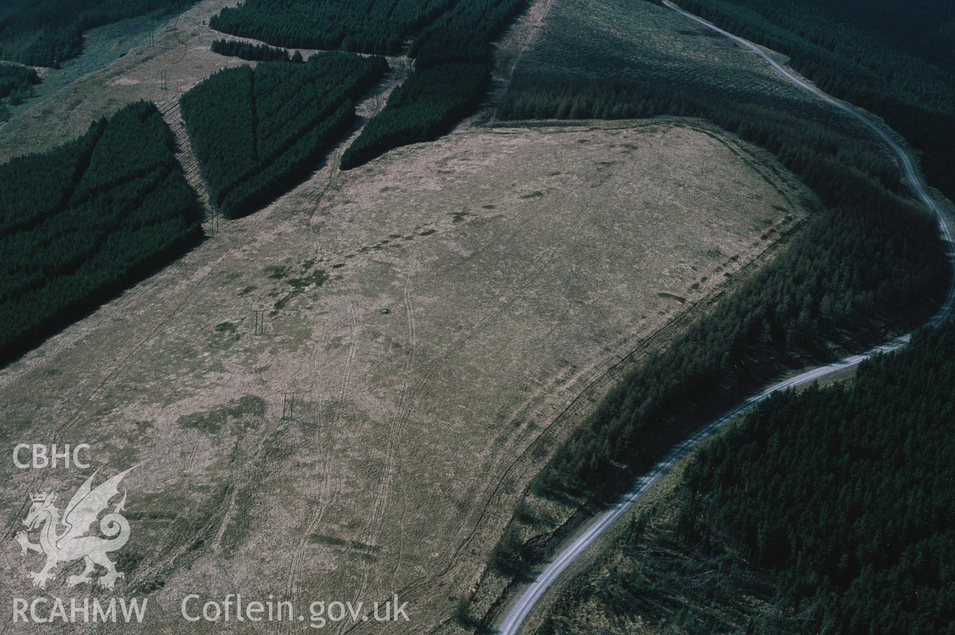 RCAHMW colour slide oblique aerial photograph of Twyn-y-bridallt Roman Camp, Ferndale, taken by C.R. Musson, 18/04/94