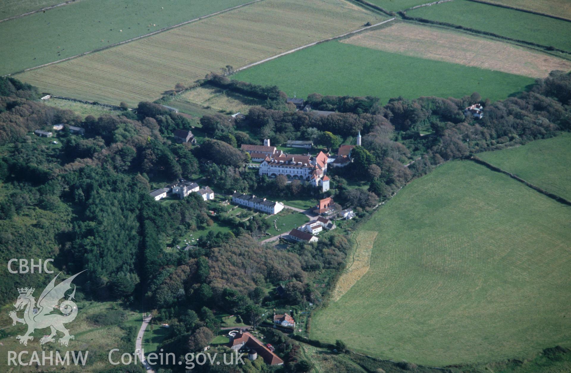 Slide of RCAHMW colour oblique aerial photograph of Caldy Old Priory;St Mary's Priory, Caldy, taken by C.R. Musson, 27/9/1990.