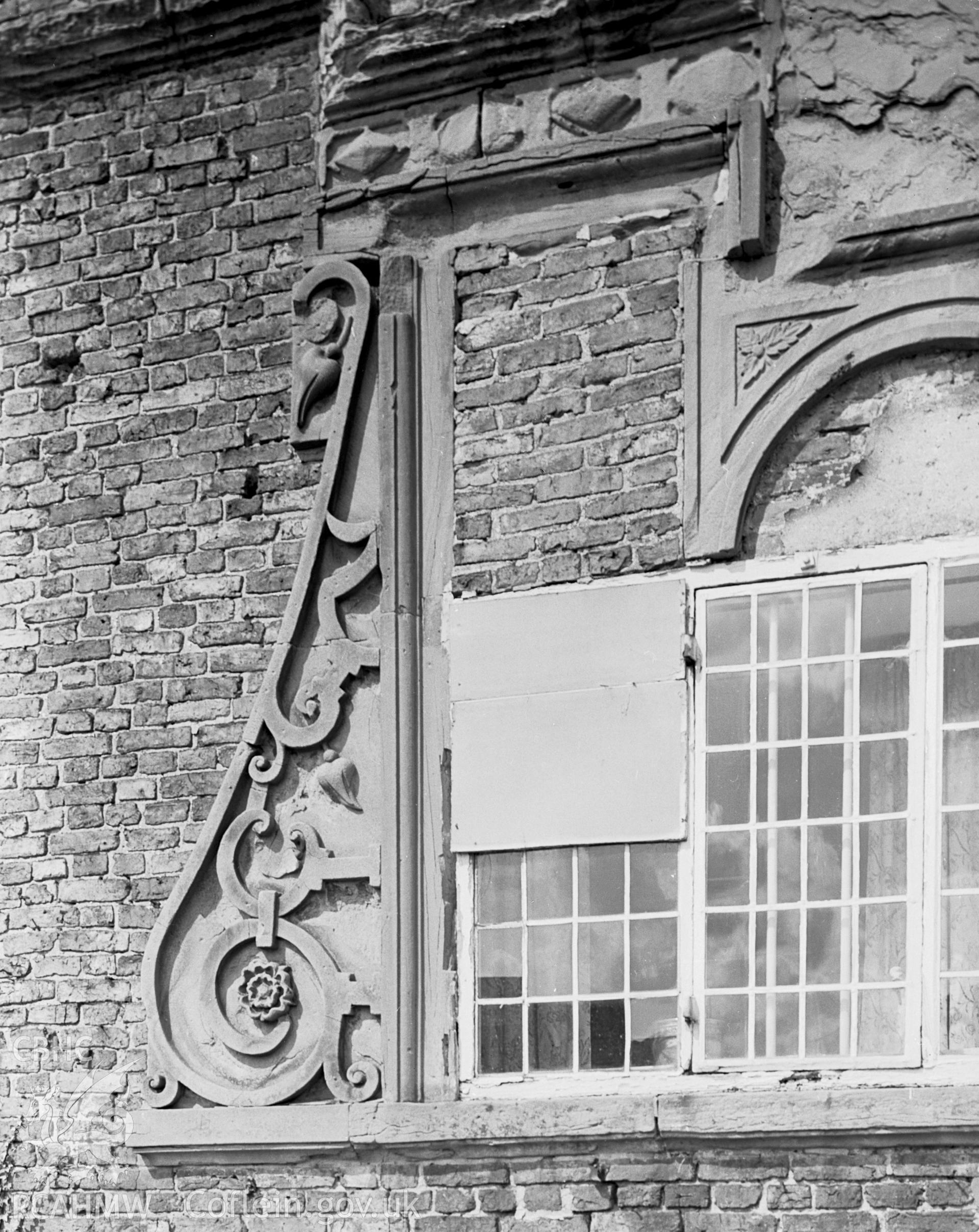 A view of the scroll-ornamented window in detail.